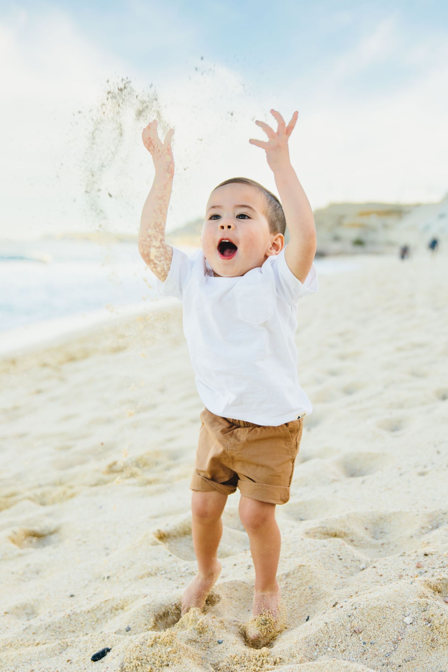 boy playing the san on the beach in Cabo San Lucas