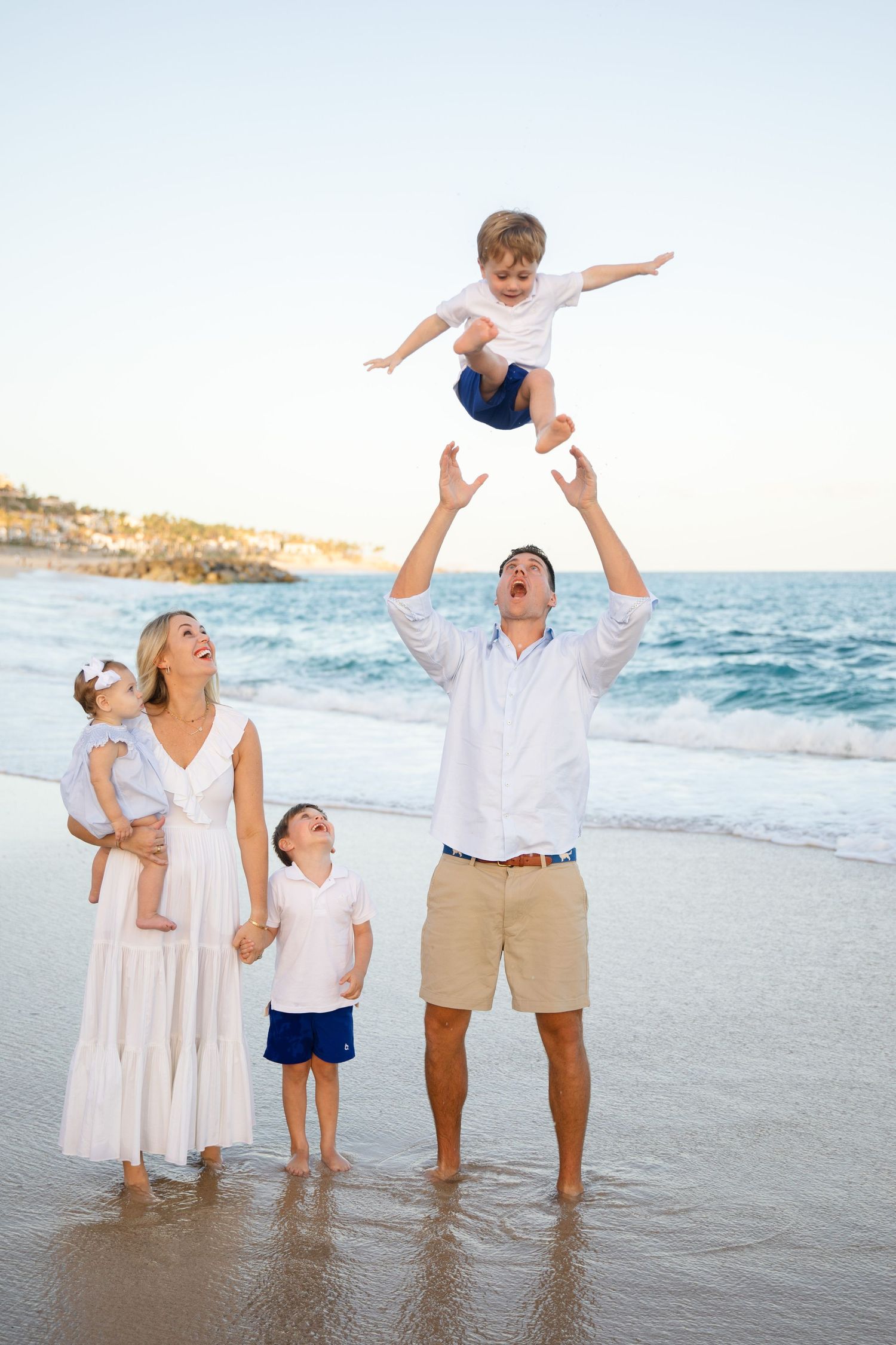 family  playing on beach in Cabo San Lucas