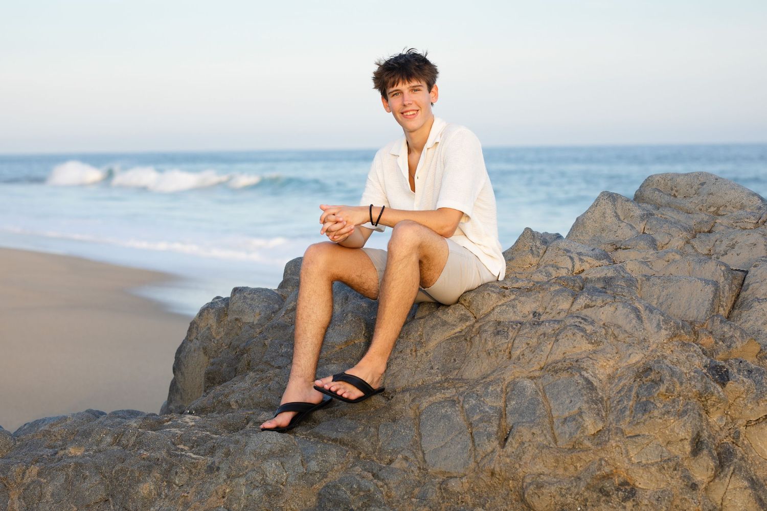 teenage boy on beach in Cabo San Lucas