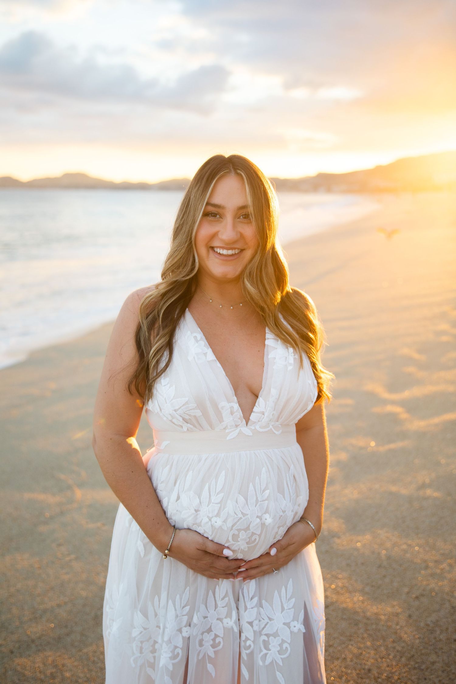 pregnant woman on beach in Cabo San Lucas