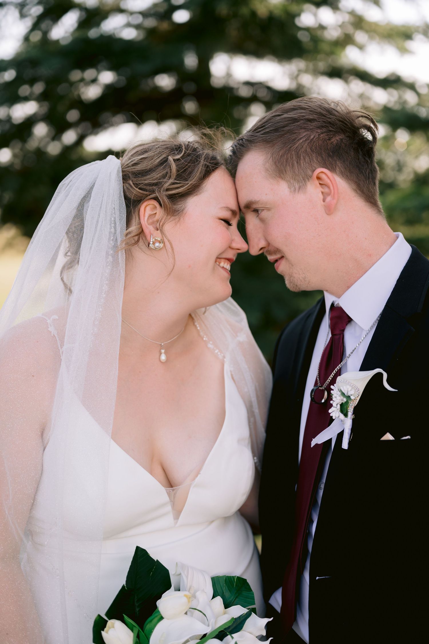 A romantic wedding couple shares an intimate moment outdoors in a series of close-up photographs.