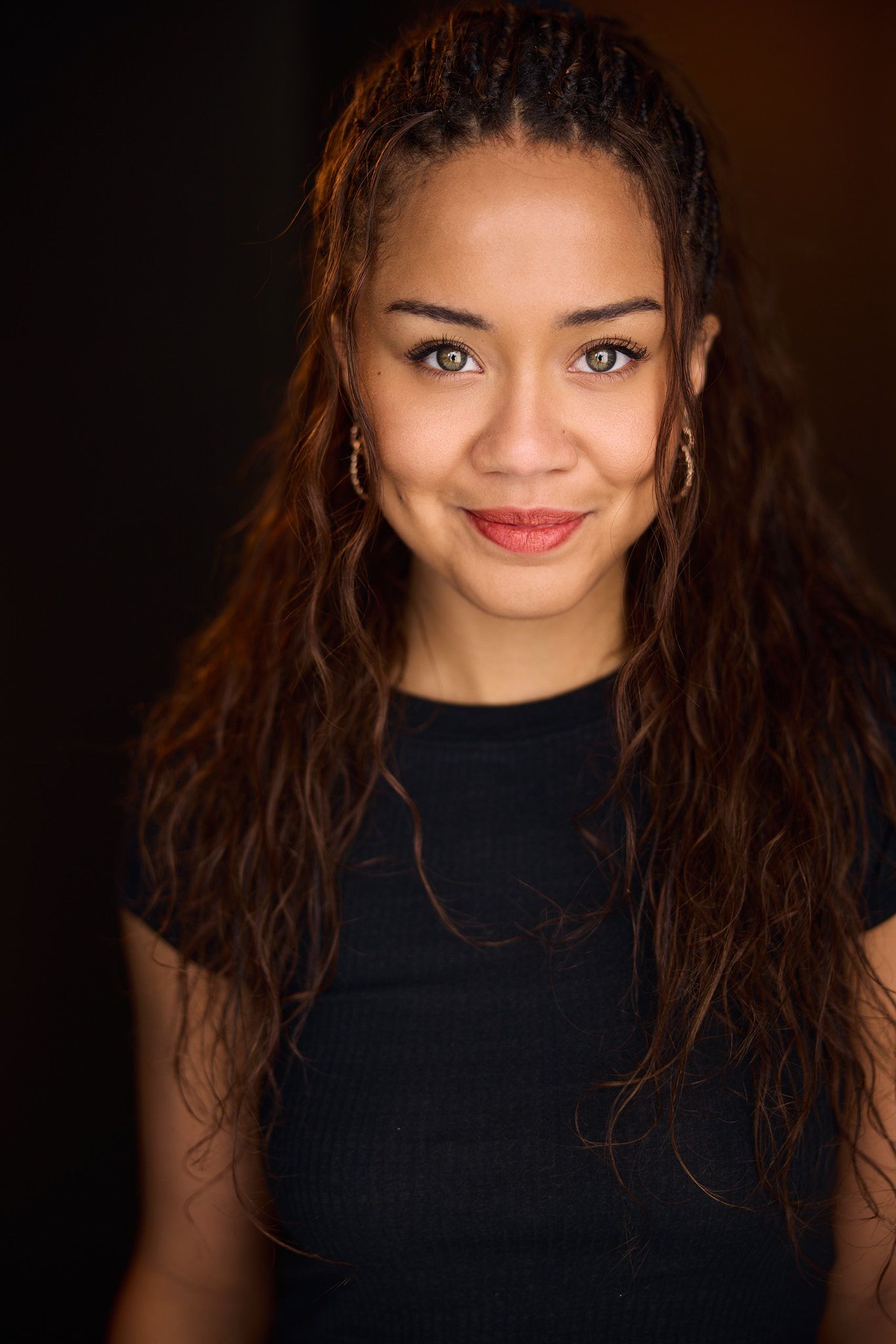 A series of portraits showing a woman in a black turtleneck with long dark hair against a dark background.