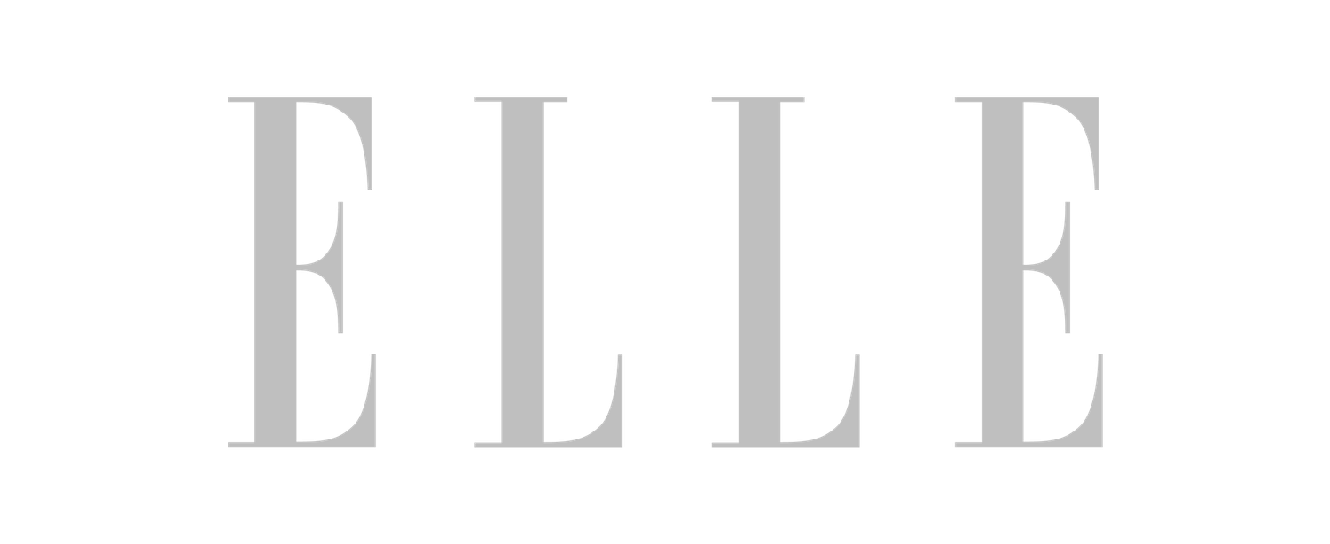 The ELLE magazine logo displayed in light gray serif typography on a white background.
