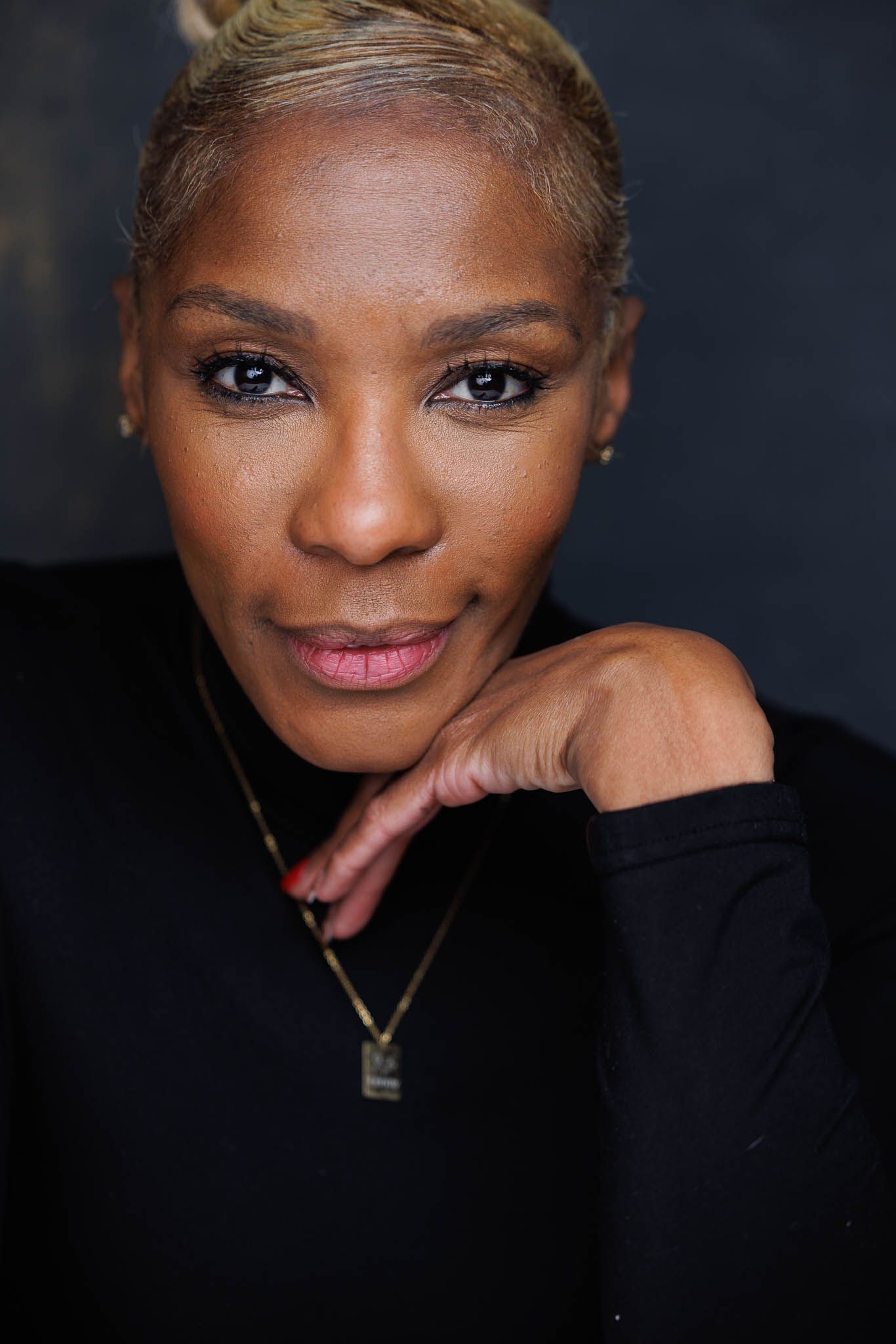 Professional portrait series showing different expressions and poses against a dark background.