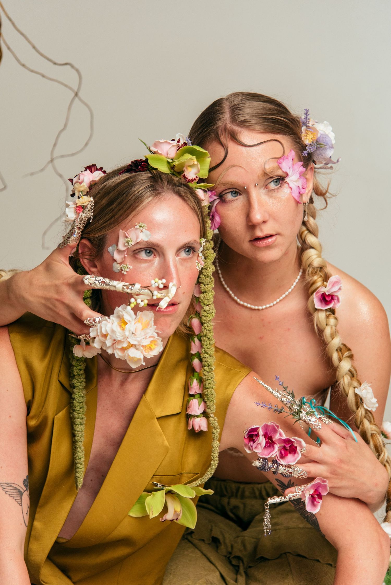 two models in creative editorial photoshoot with dramatic floral makeup in raleigh, nc