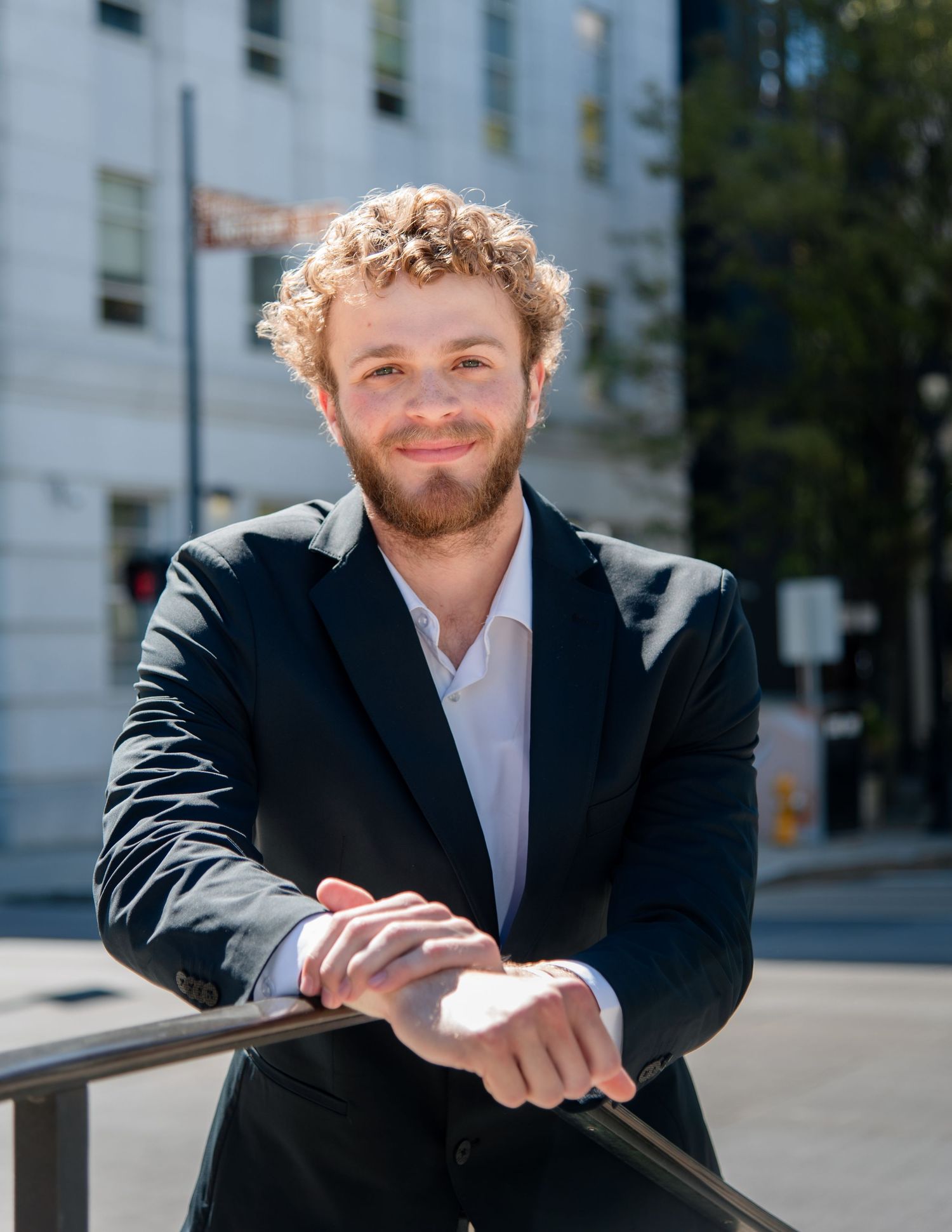 Professional male headshot photography outdoors professional building downtown raleigh, nc