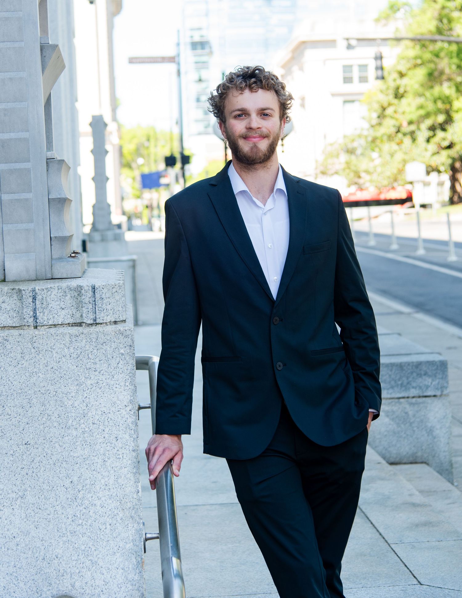 Professional male headshot photography outdoors professional building downtown raleigh, nc