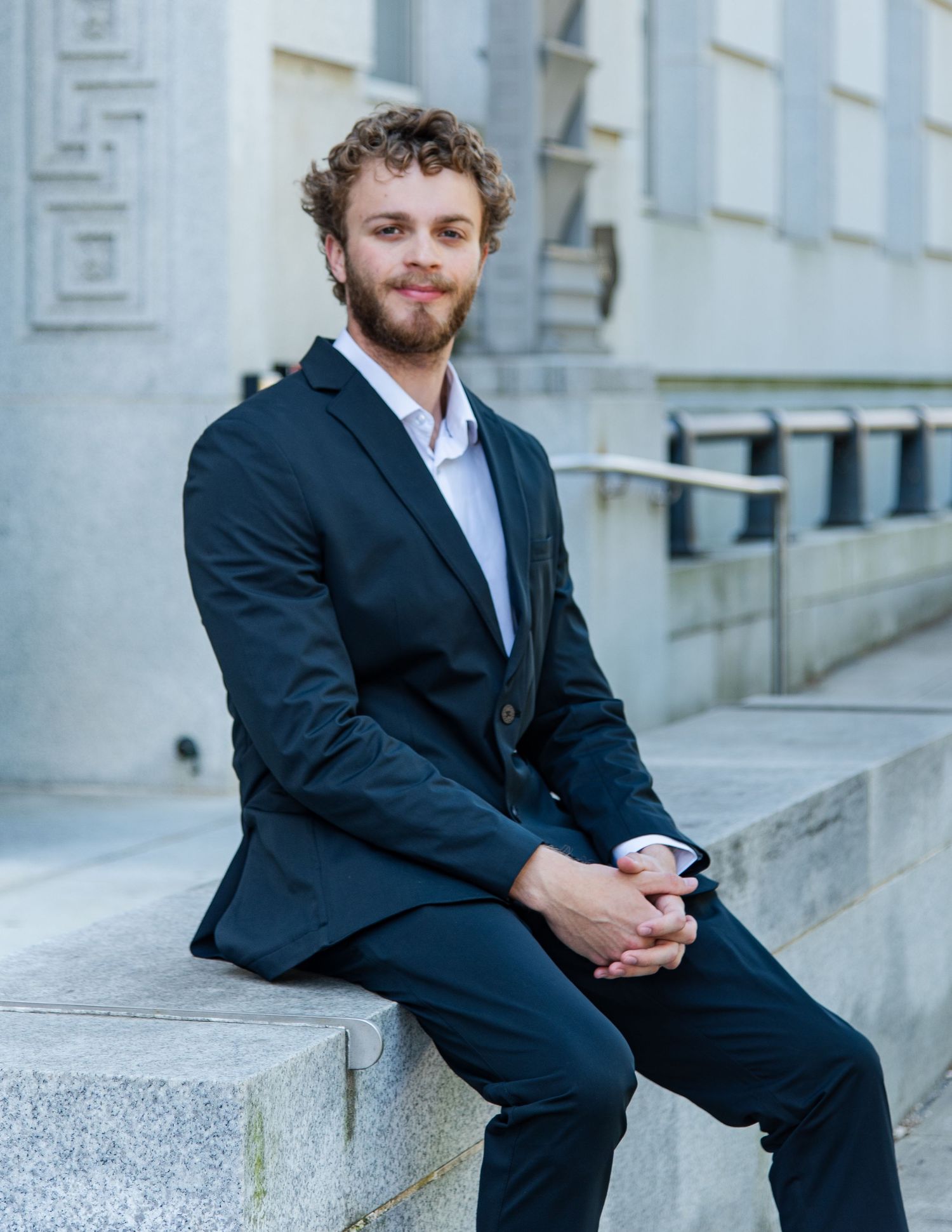 Professional male headshot photography outdoors professional building downtown raleigh, nc