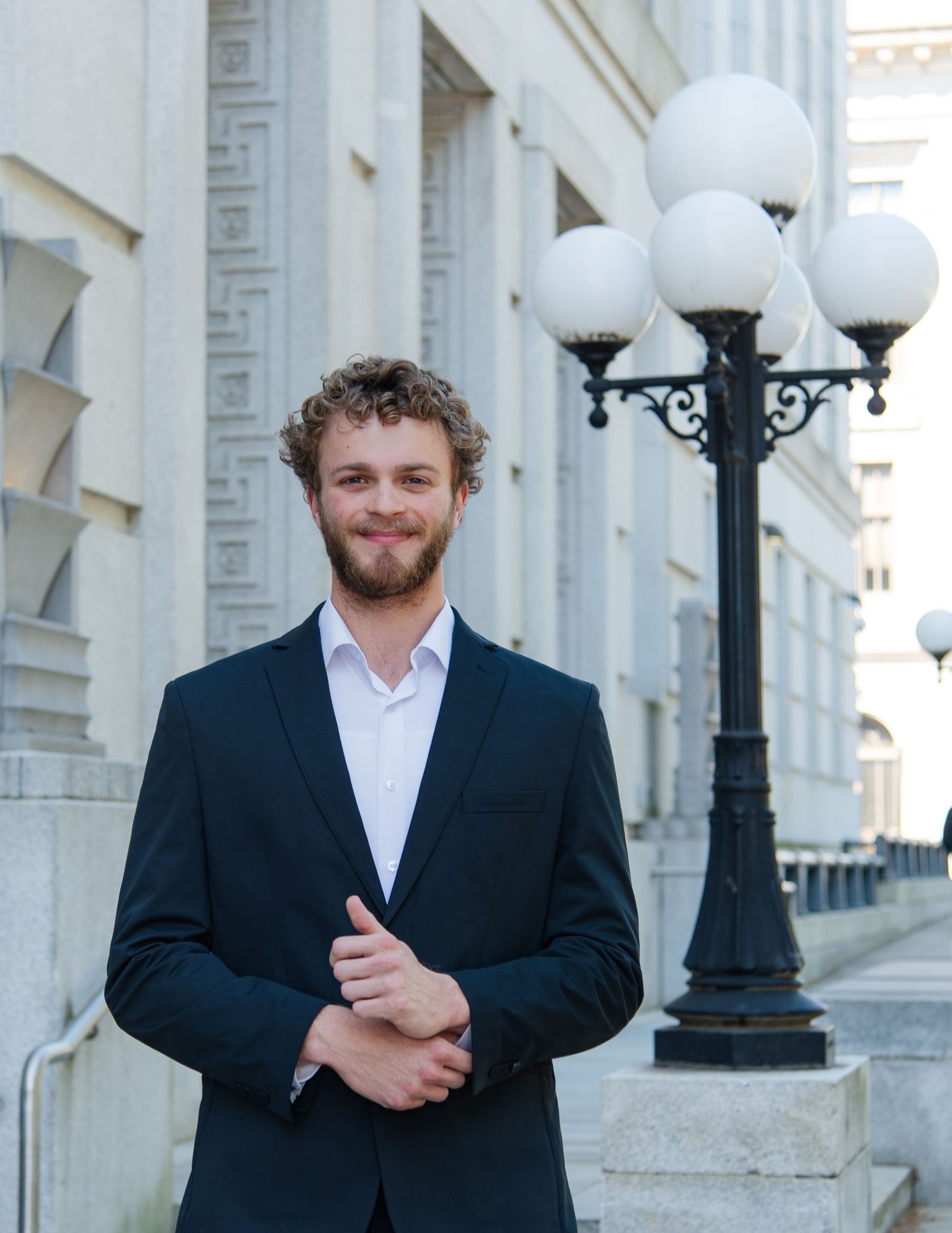 Professional male headshot photography outdoors professional building downtown raleigh, nc