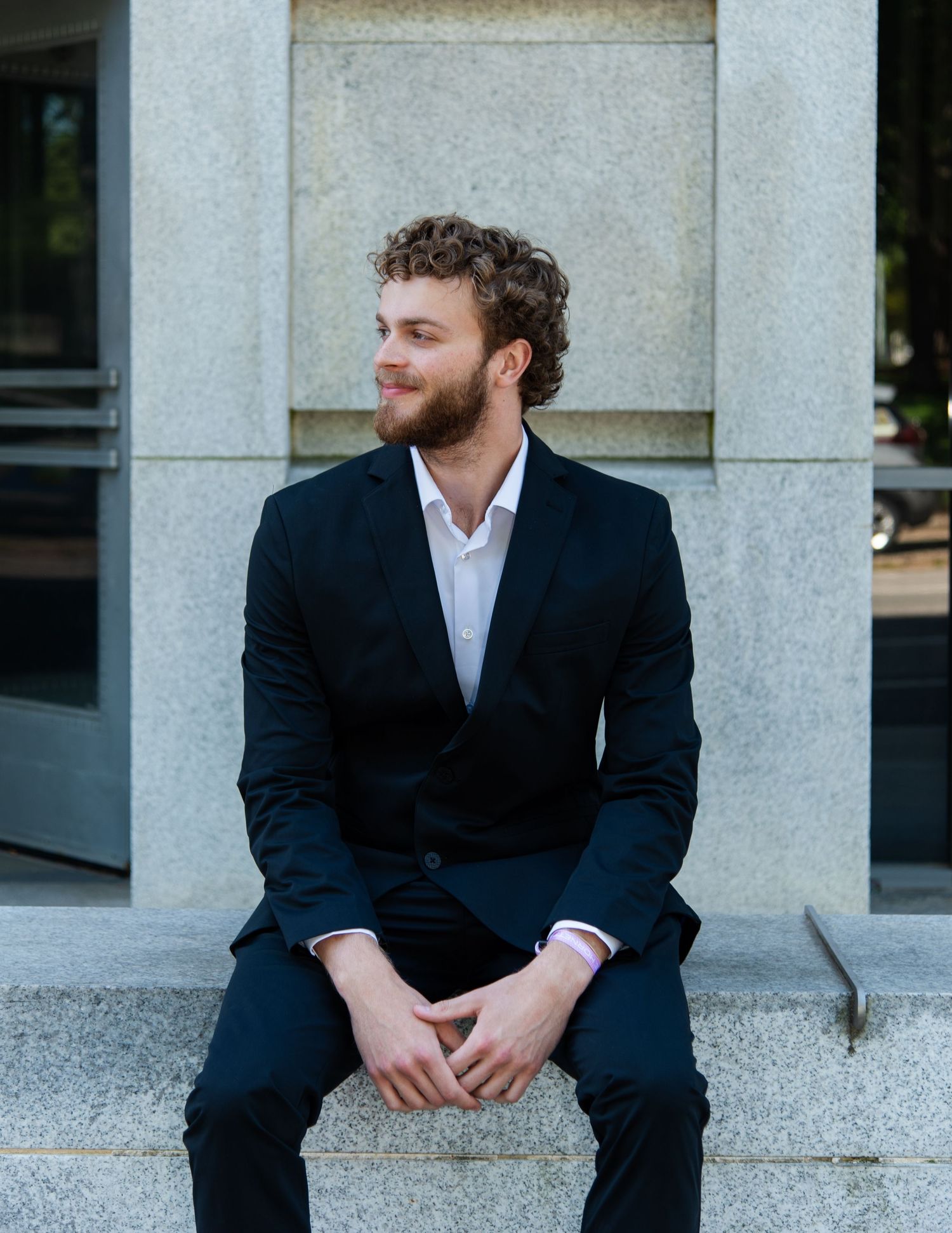 Professional male headshot photography outdoors professional building downtown raleigh, nc