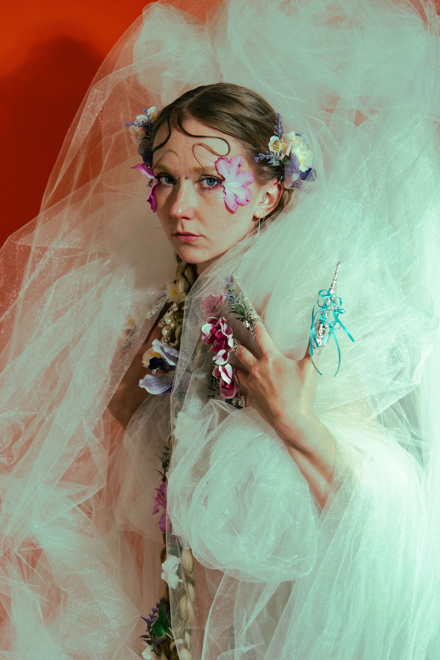 model with long hair and dramatic floral makeup for editorial photoshoot