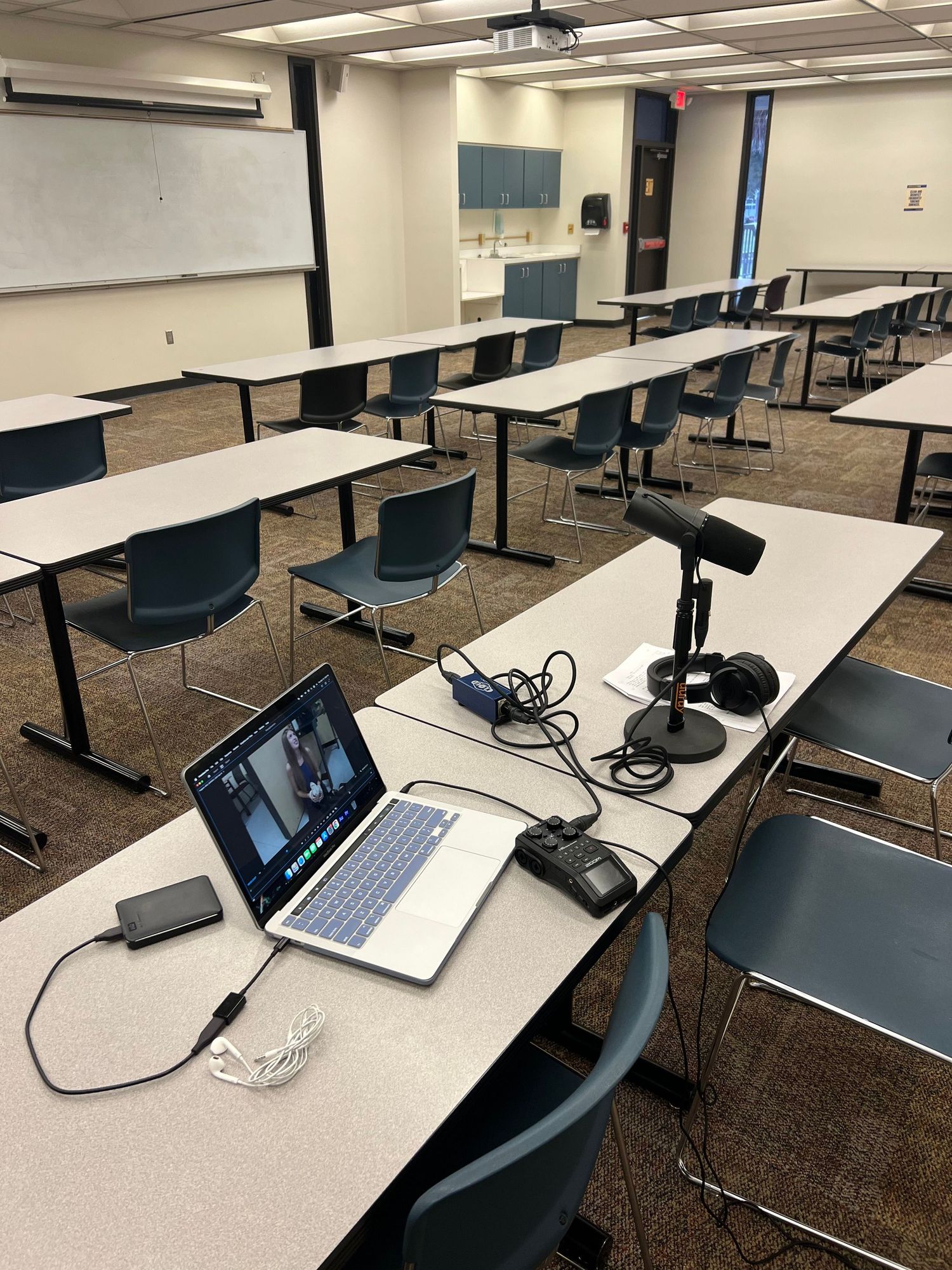 Laptop and microphones on a desk to record ADR.