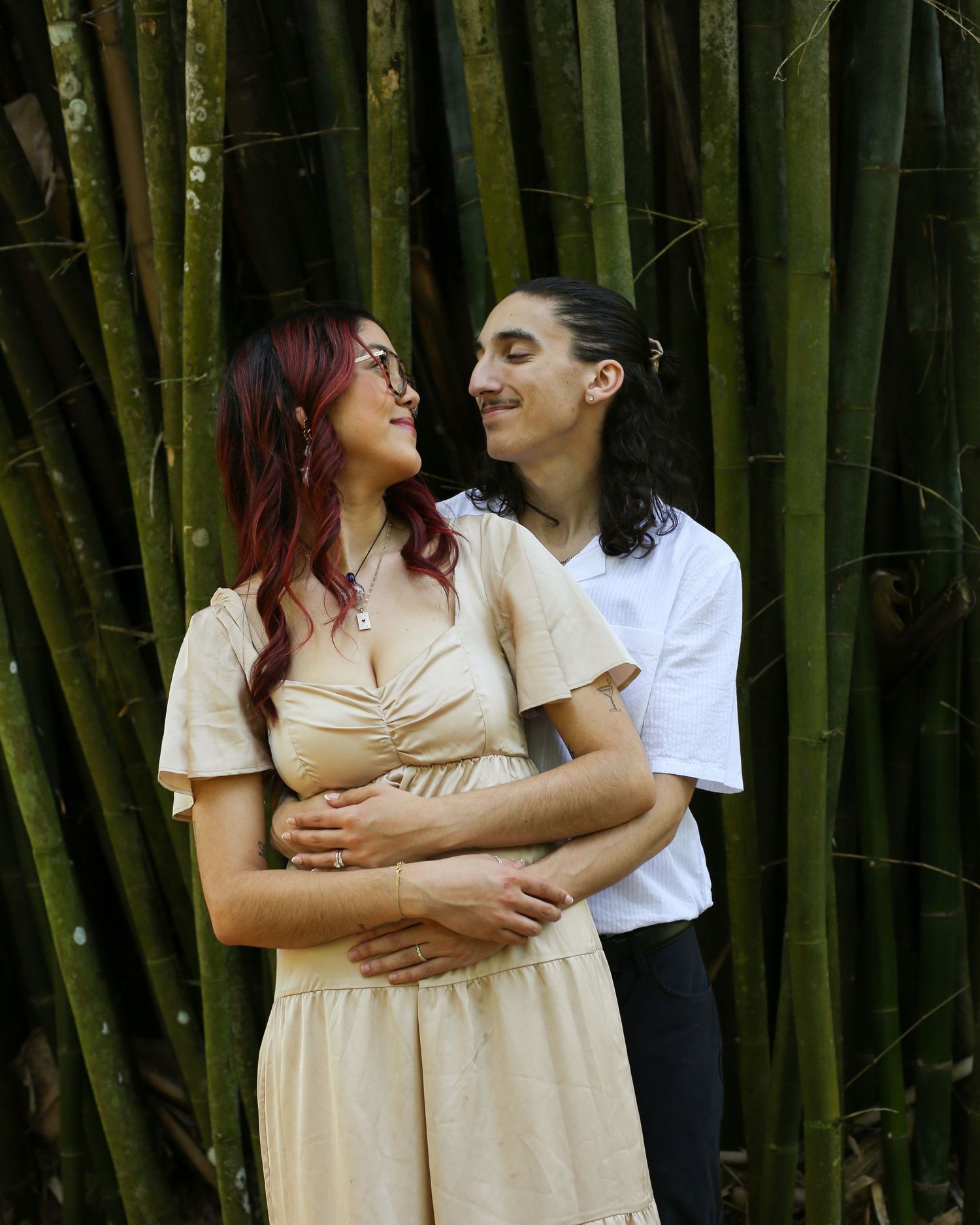 Loving embrace against a backdrop of tall bamboo stalks at Harry P. Leu Gardens in Florida.