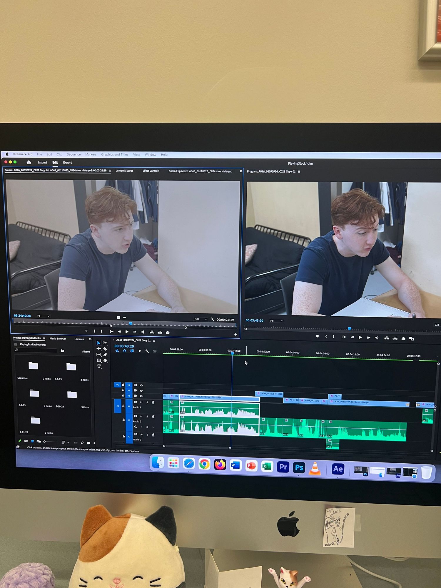 Adobe Premiere Pro editing timeline showing color grading clips and waveforms on an iMac display.