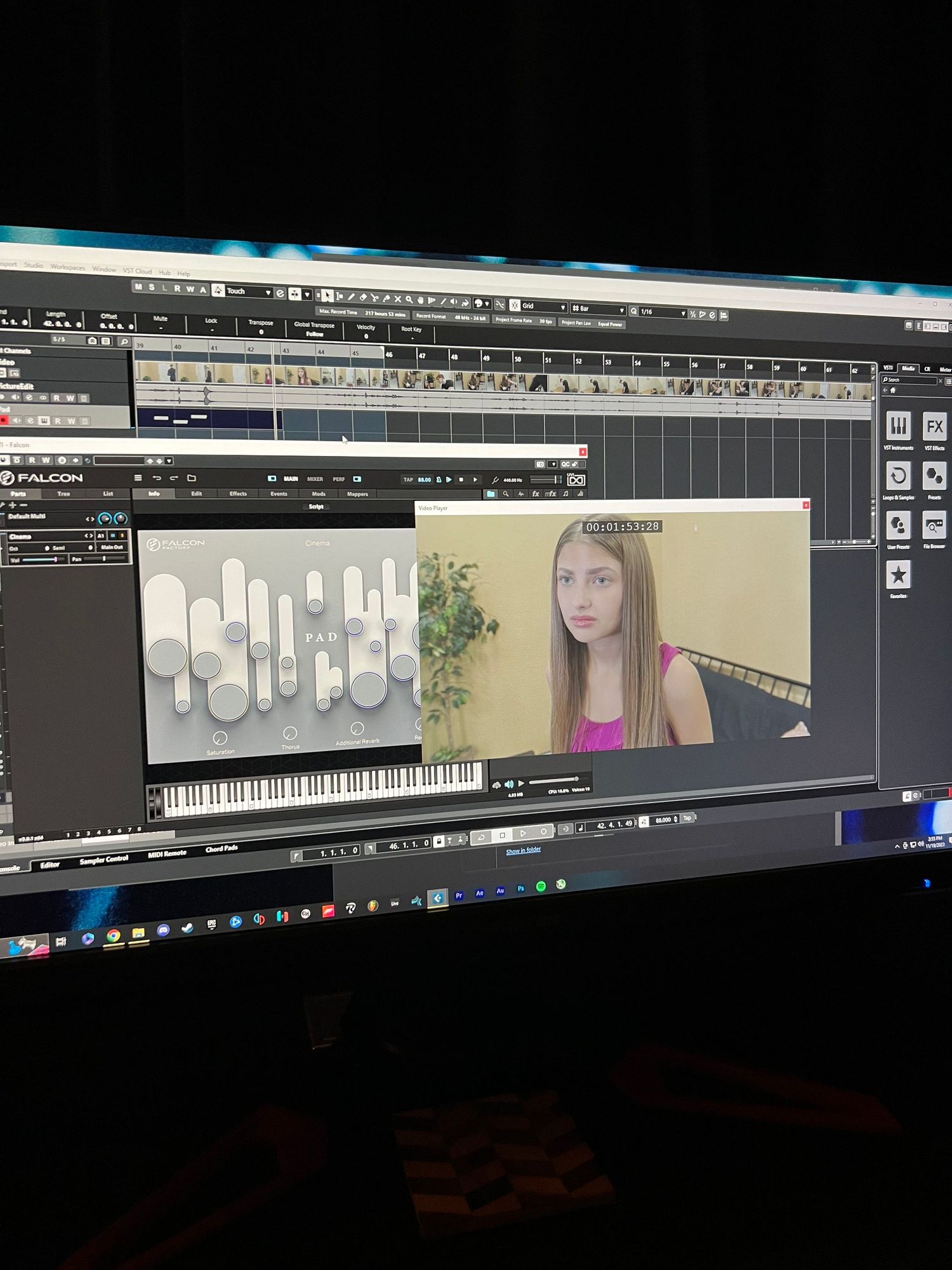 Video editing software interface showing audio waveforms and video preview window.