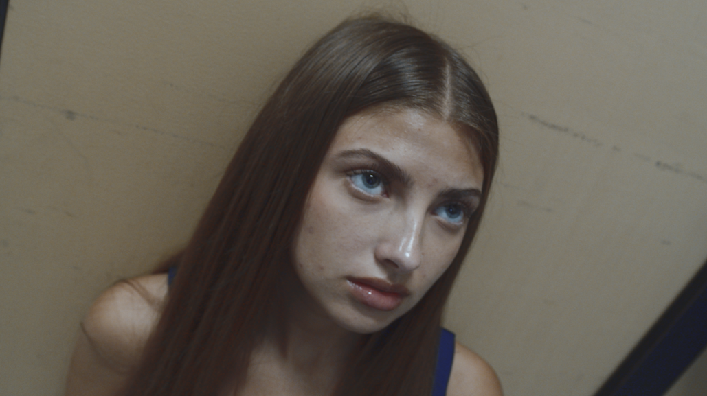 Still of a young woman from a short film.