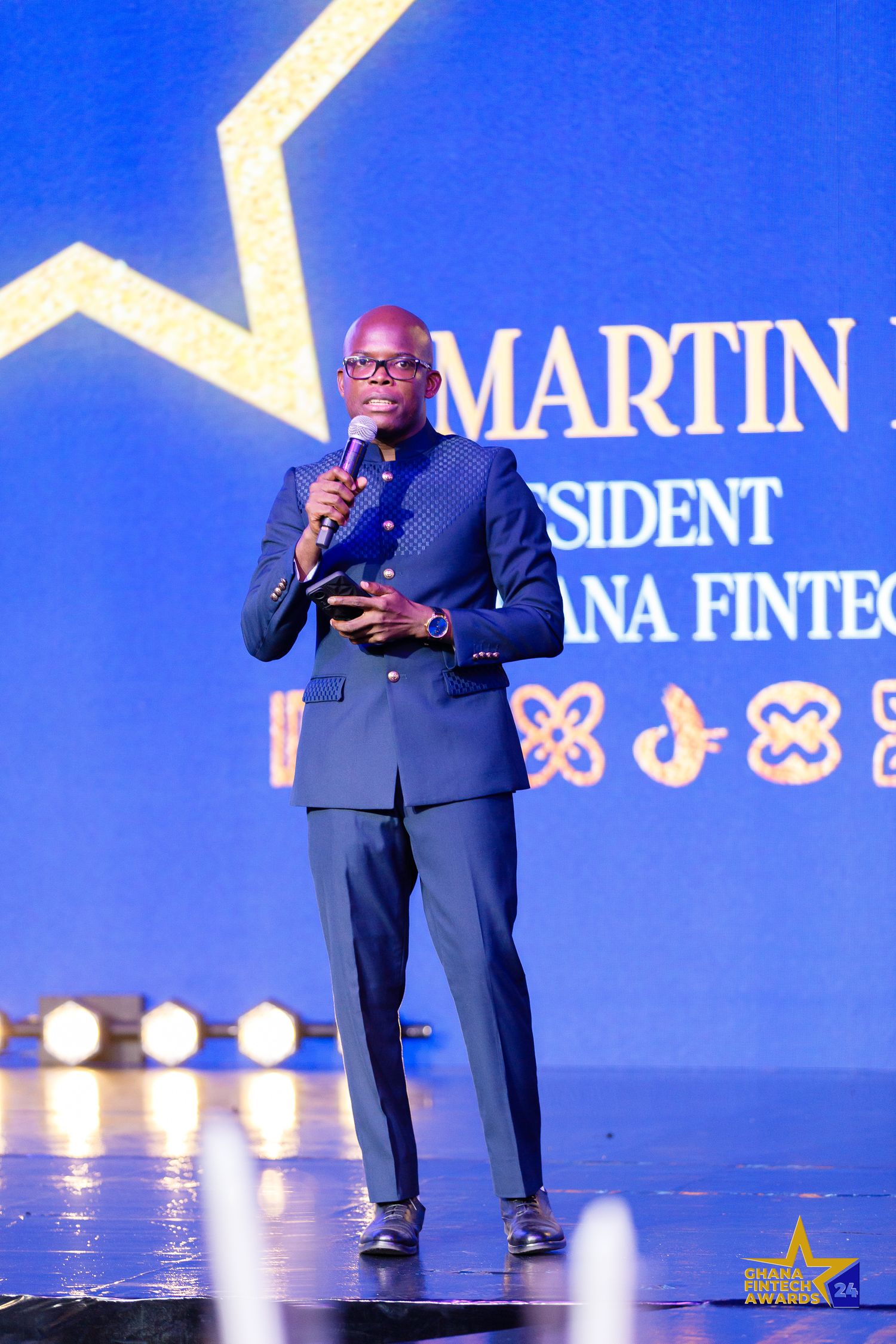 Candid moment from a corporate event in Accra photographed by The BLUEshutter.