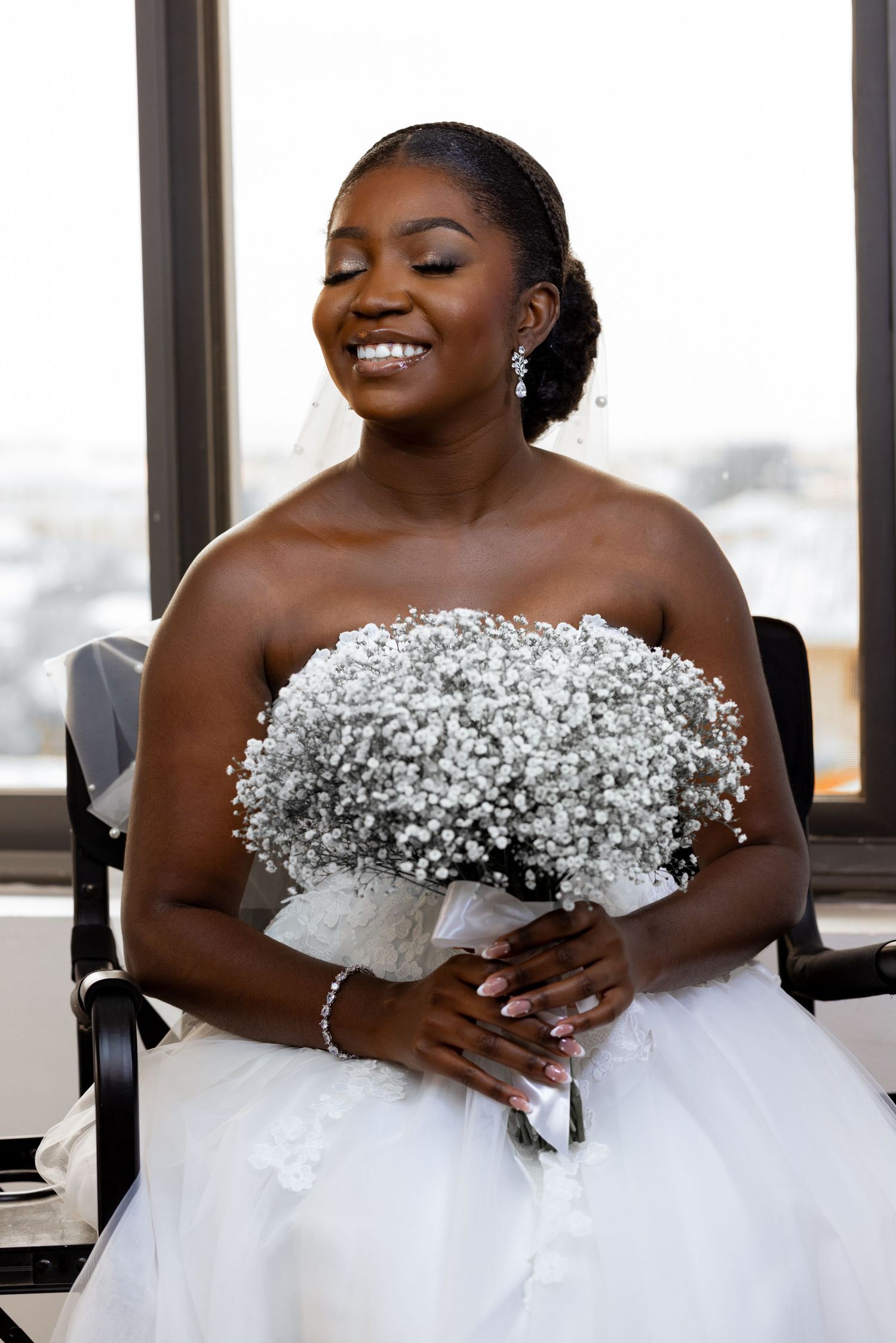 Lace wedding gown detail as bride gets dressed