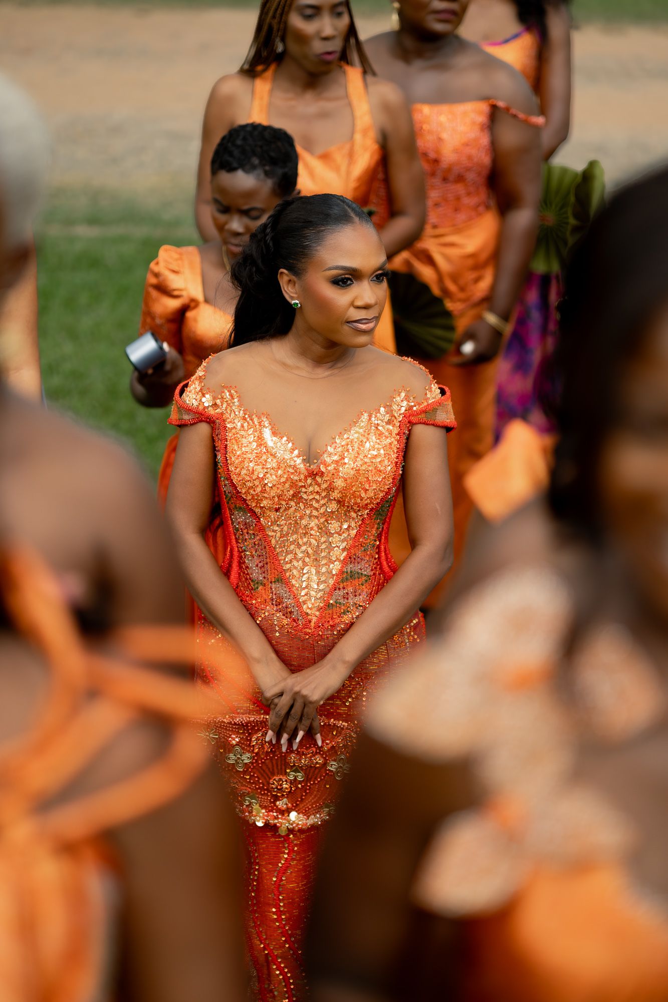 Bride and bridesmiads making a grand entrance at a wedding ceremony in Ghana