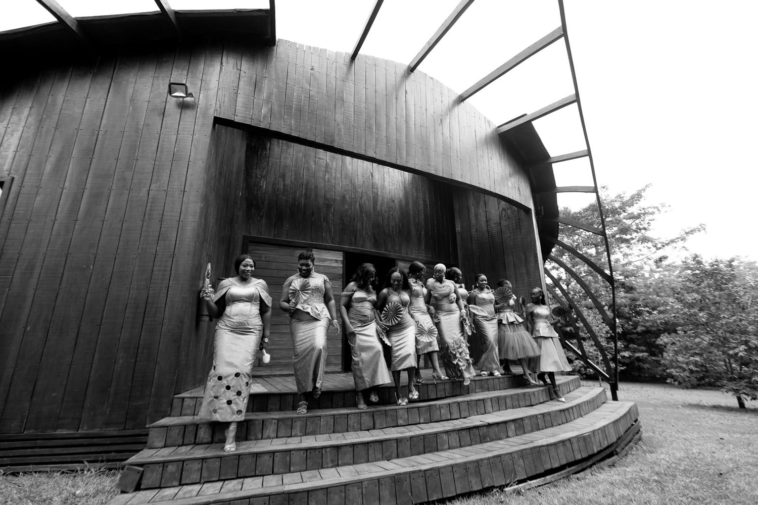 fun group photo of bride and bridesmaids outdoors