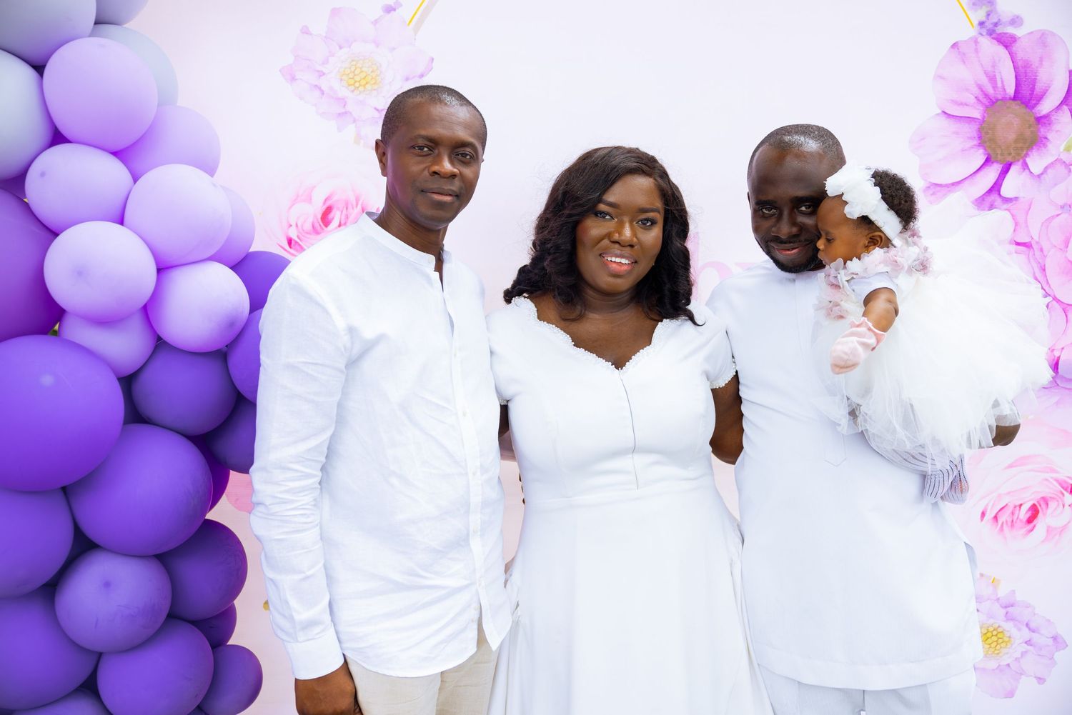 Baby surrounded by family at naming celebration reception