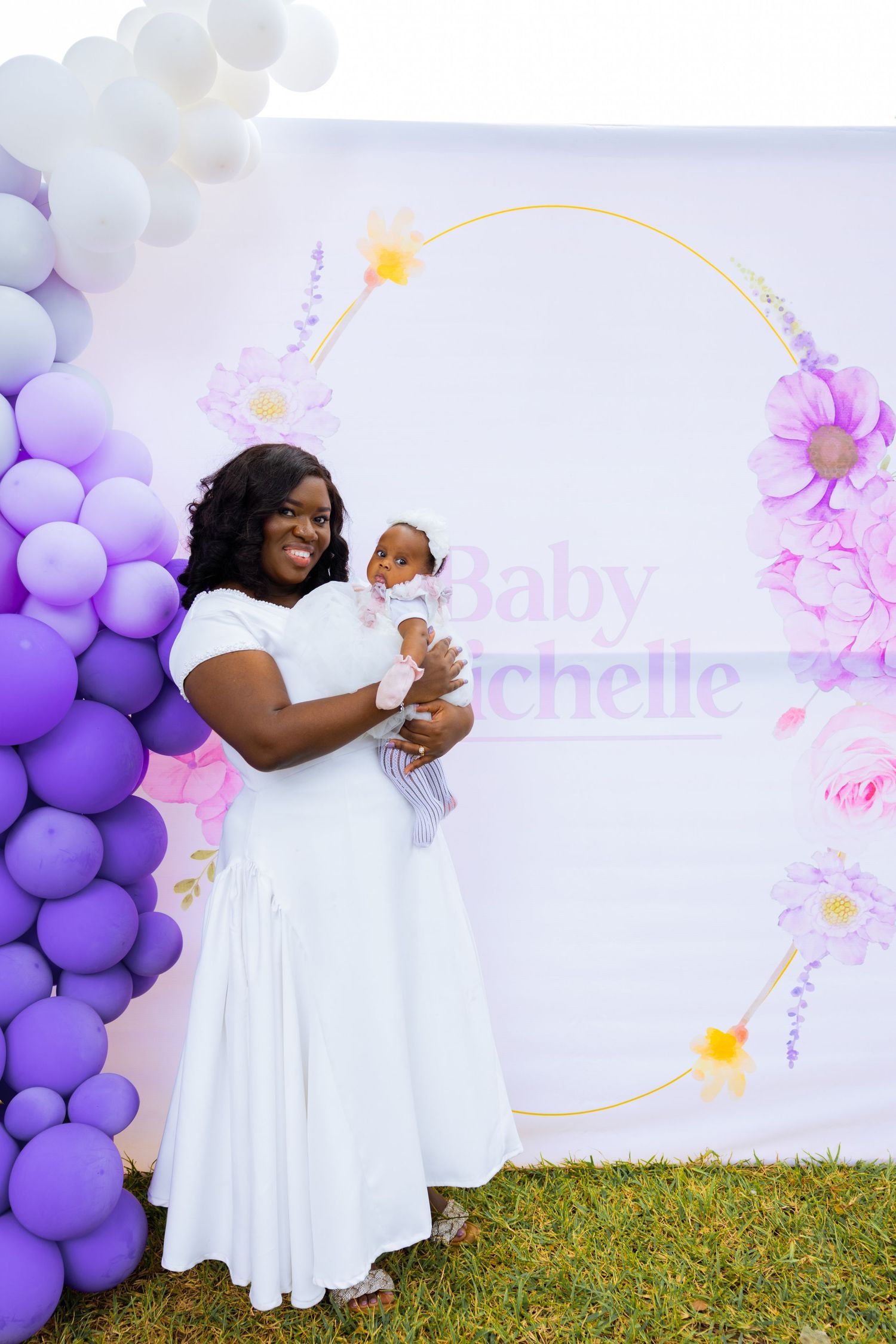 Baby surrounded by family at naming celebration reception