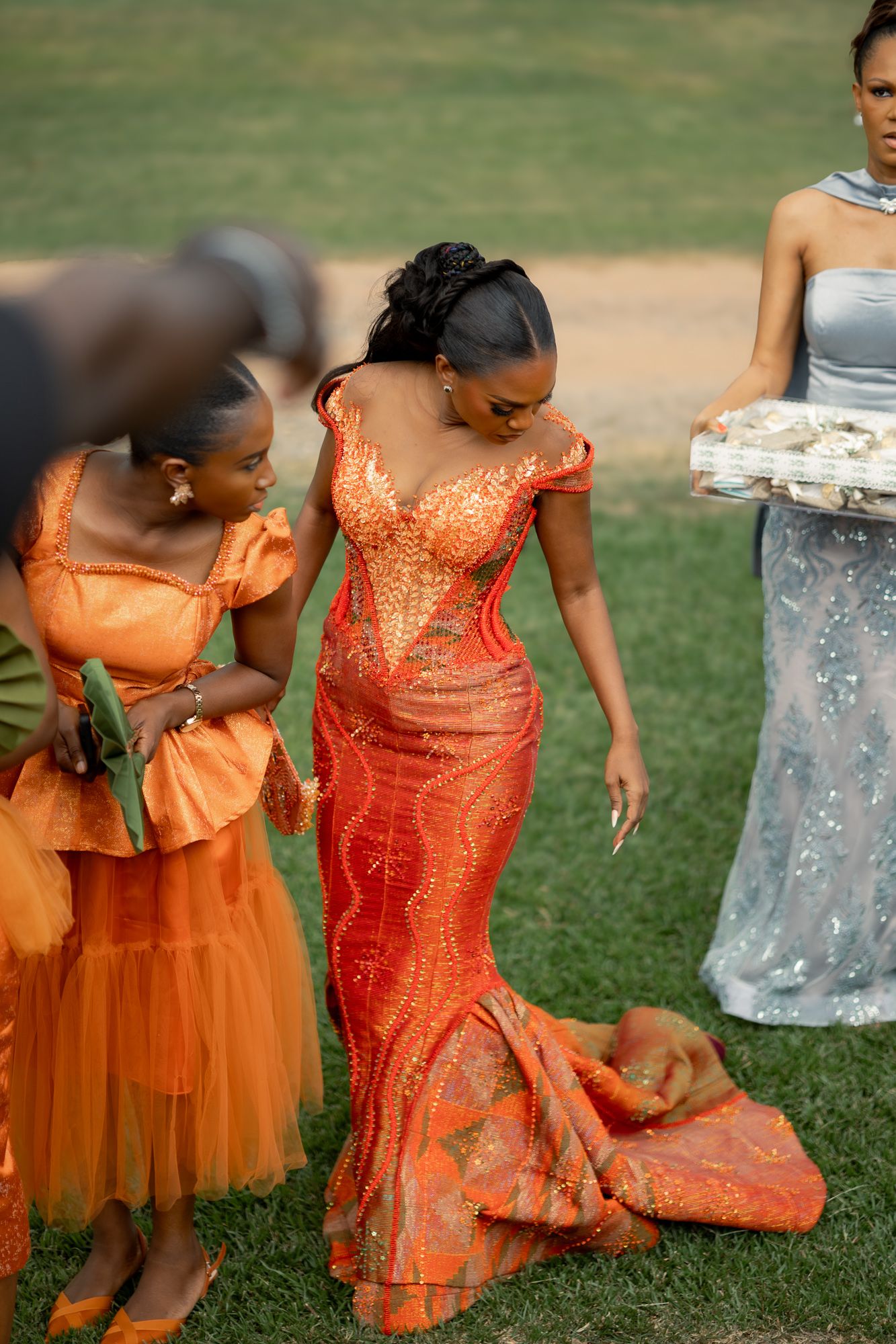 Bride and bridesmiads making a grand entrance at a wedding ceremony in Ghana