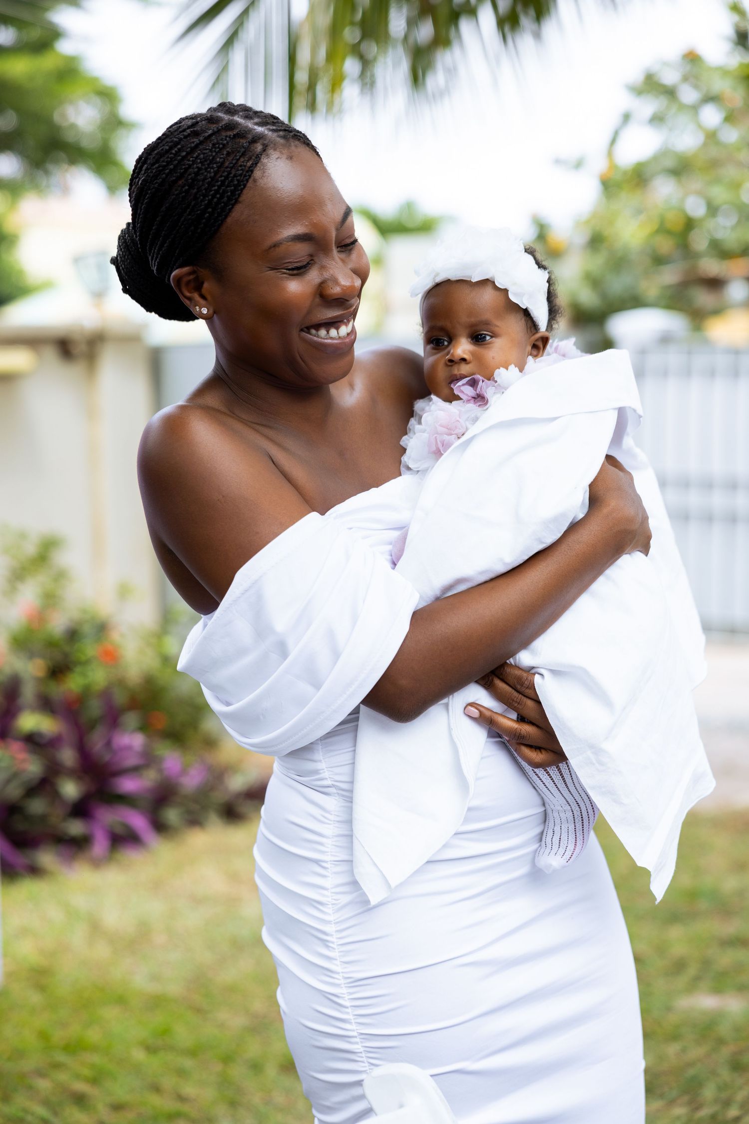 Baby surrounded by family at naming celebration reception