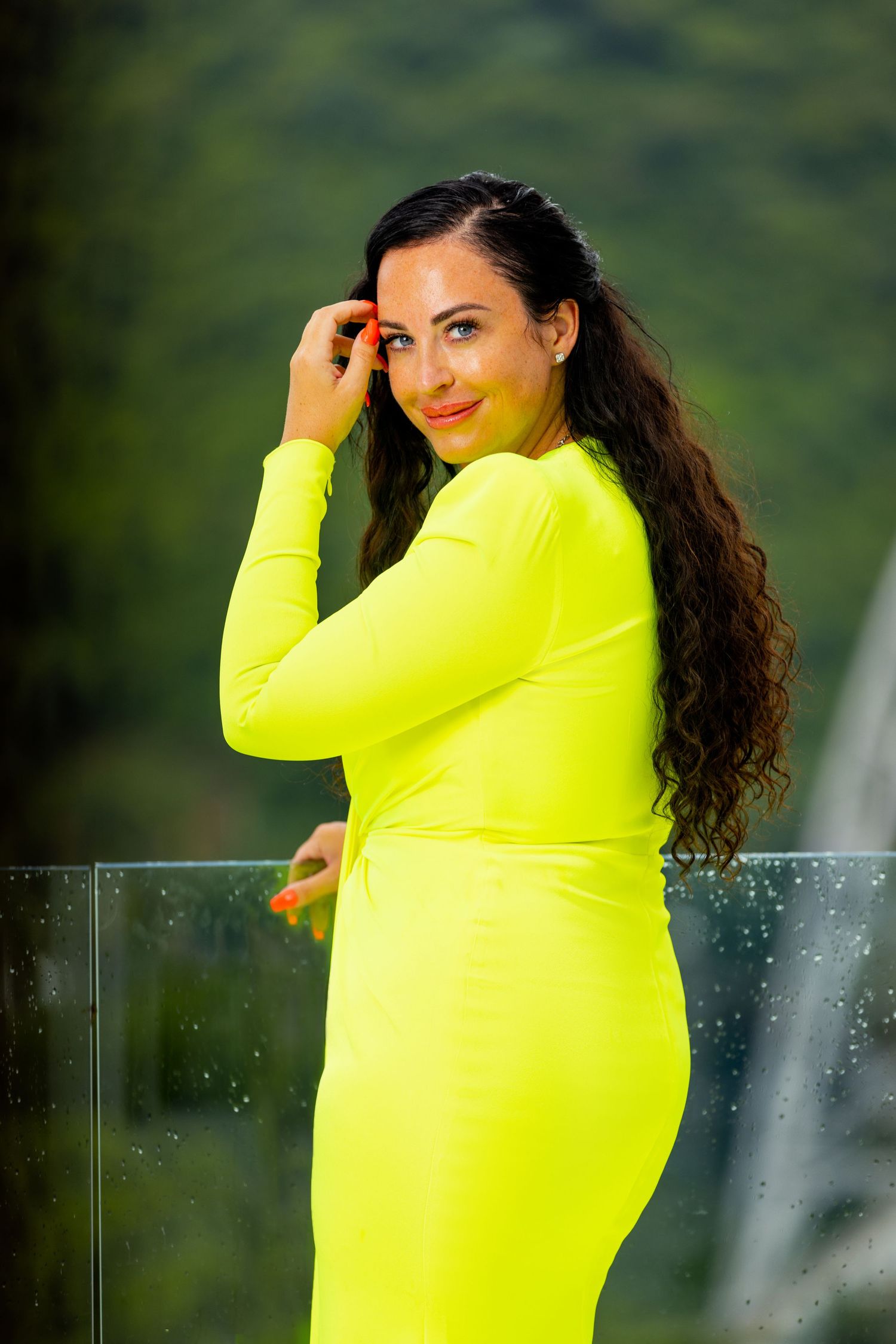 Natural light portrait with greenery in the background