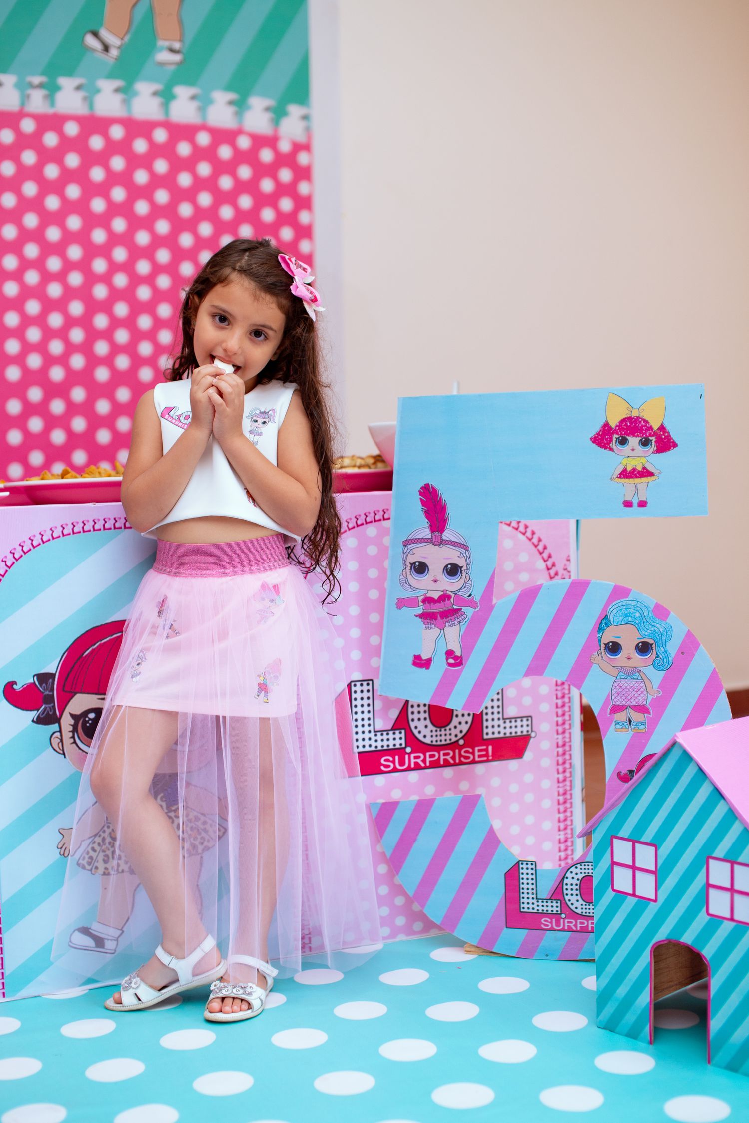 Colorful 5th birthday party setup with balloons and themed decor