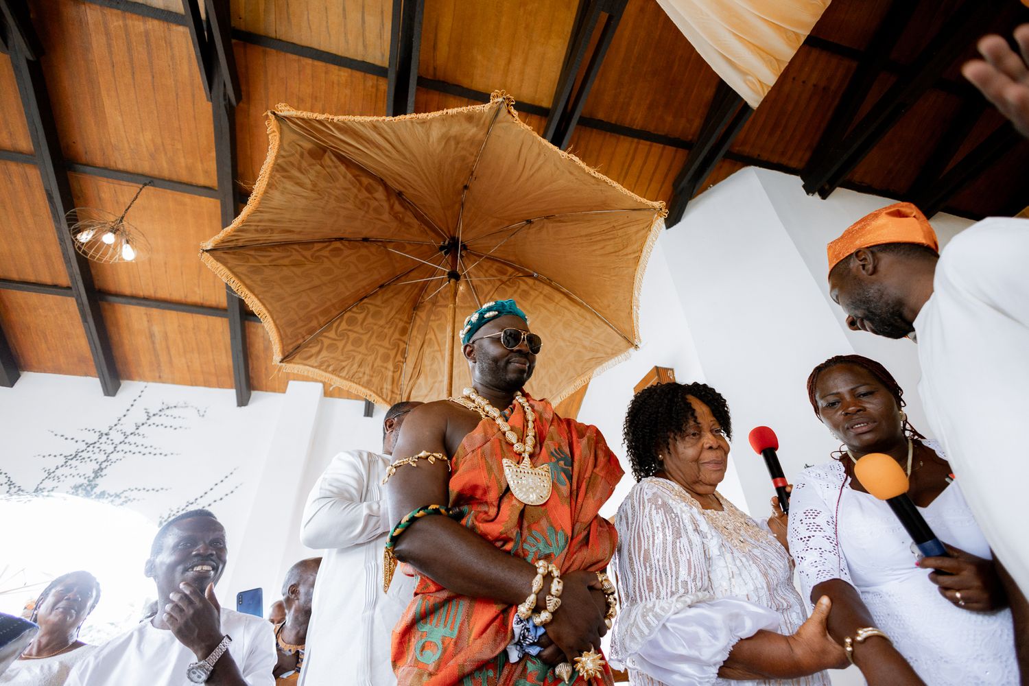 Groom making his entrance at wedding ceremony in Accra win kente