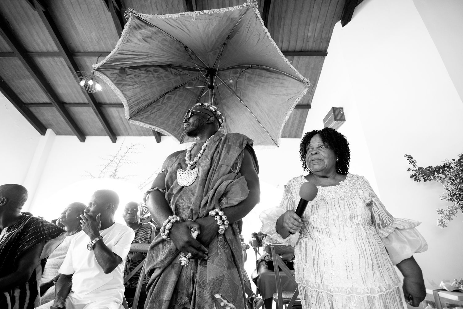 Groom making his entrance at wedding ceremony in Accra win kente