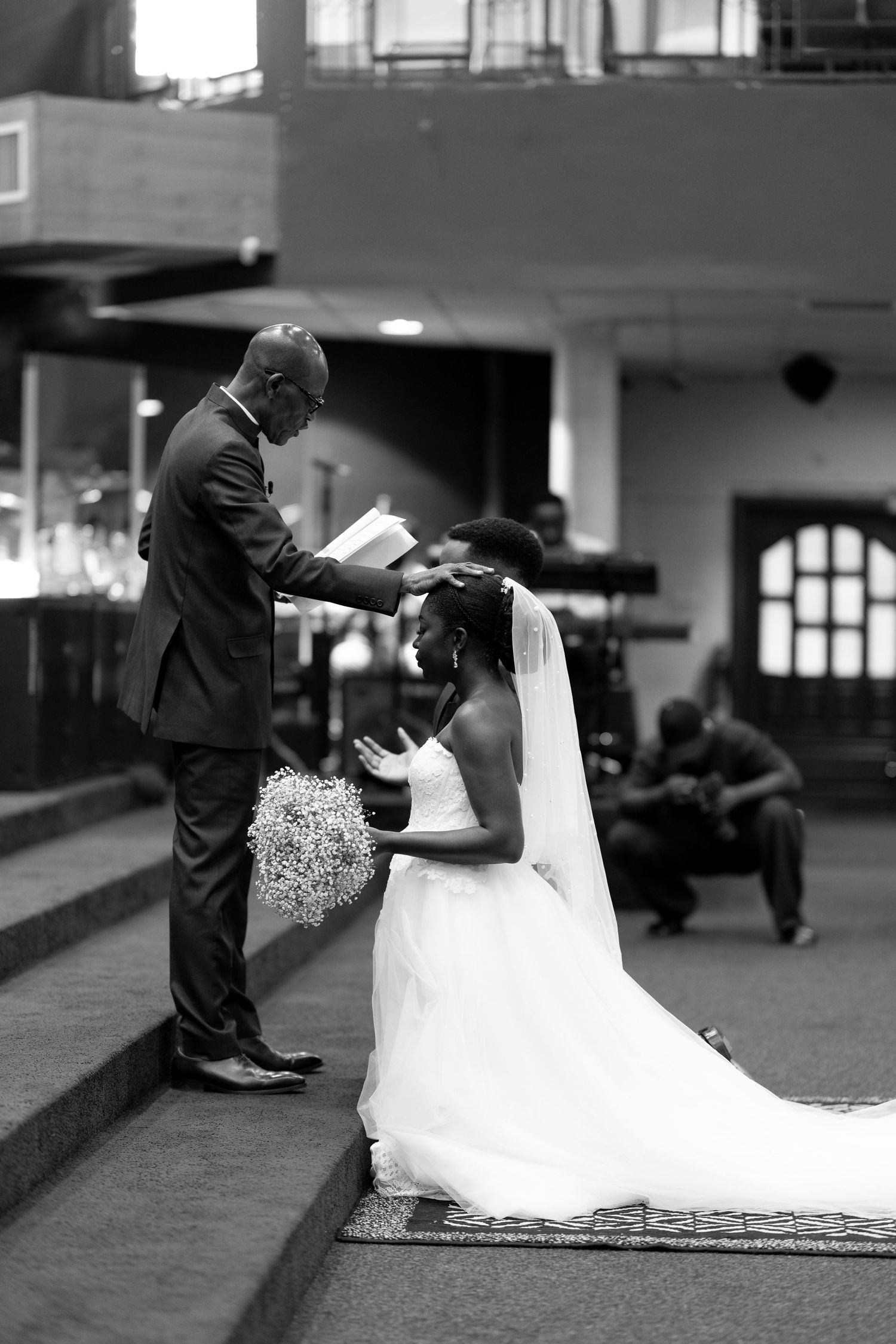 Candid moment of couple laughing during wedding shoot