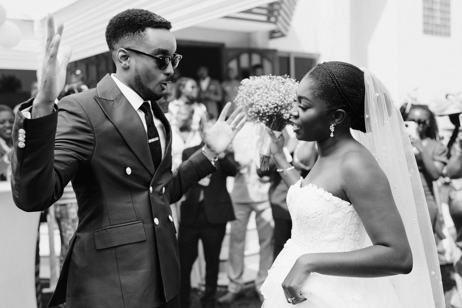 joyful couple dancing at Ghanaian wedding reception