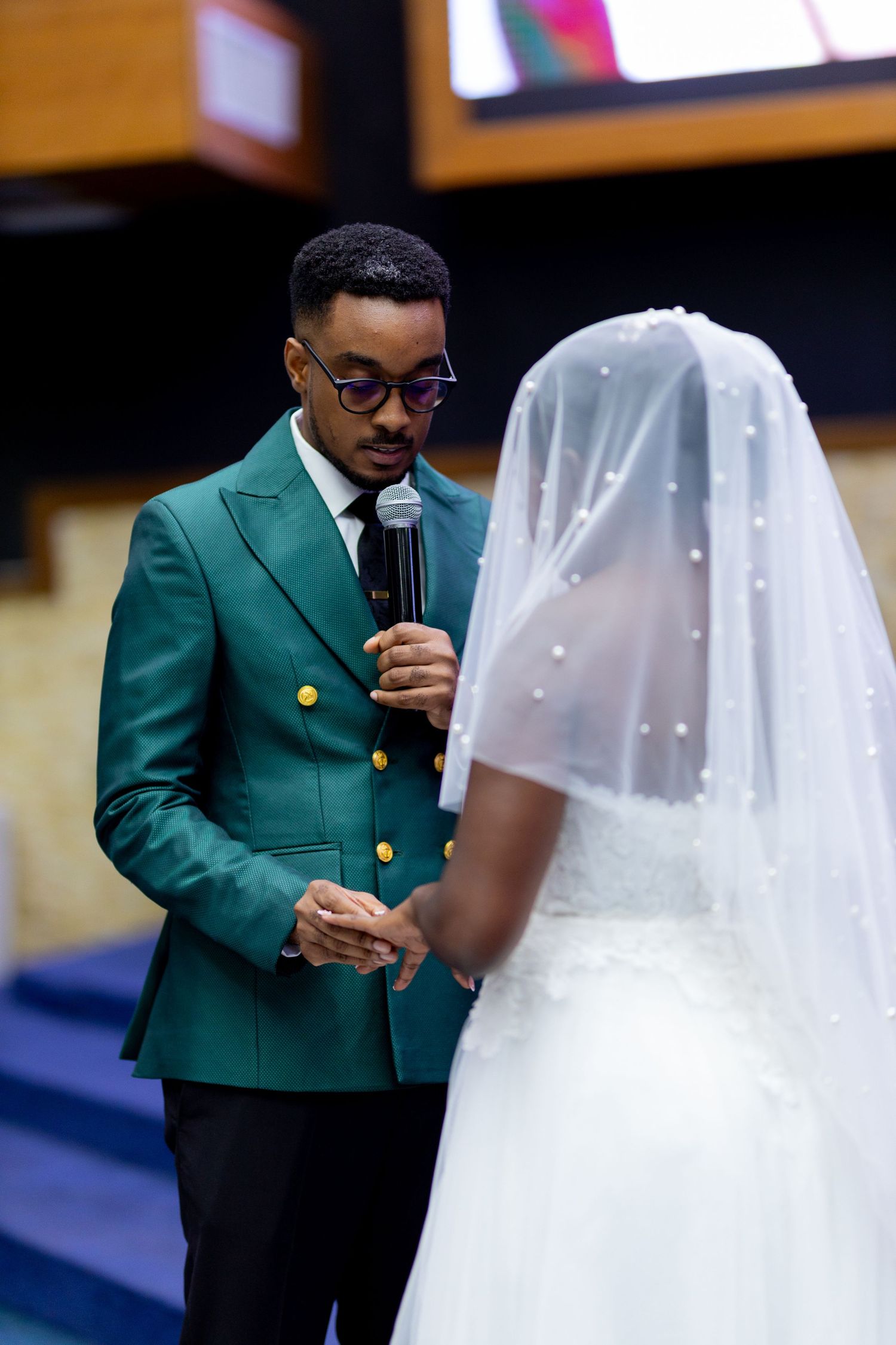 Bride and groom at the church at a wedding  exhange of vows