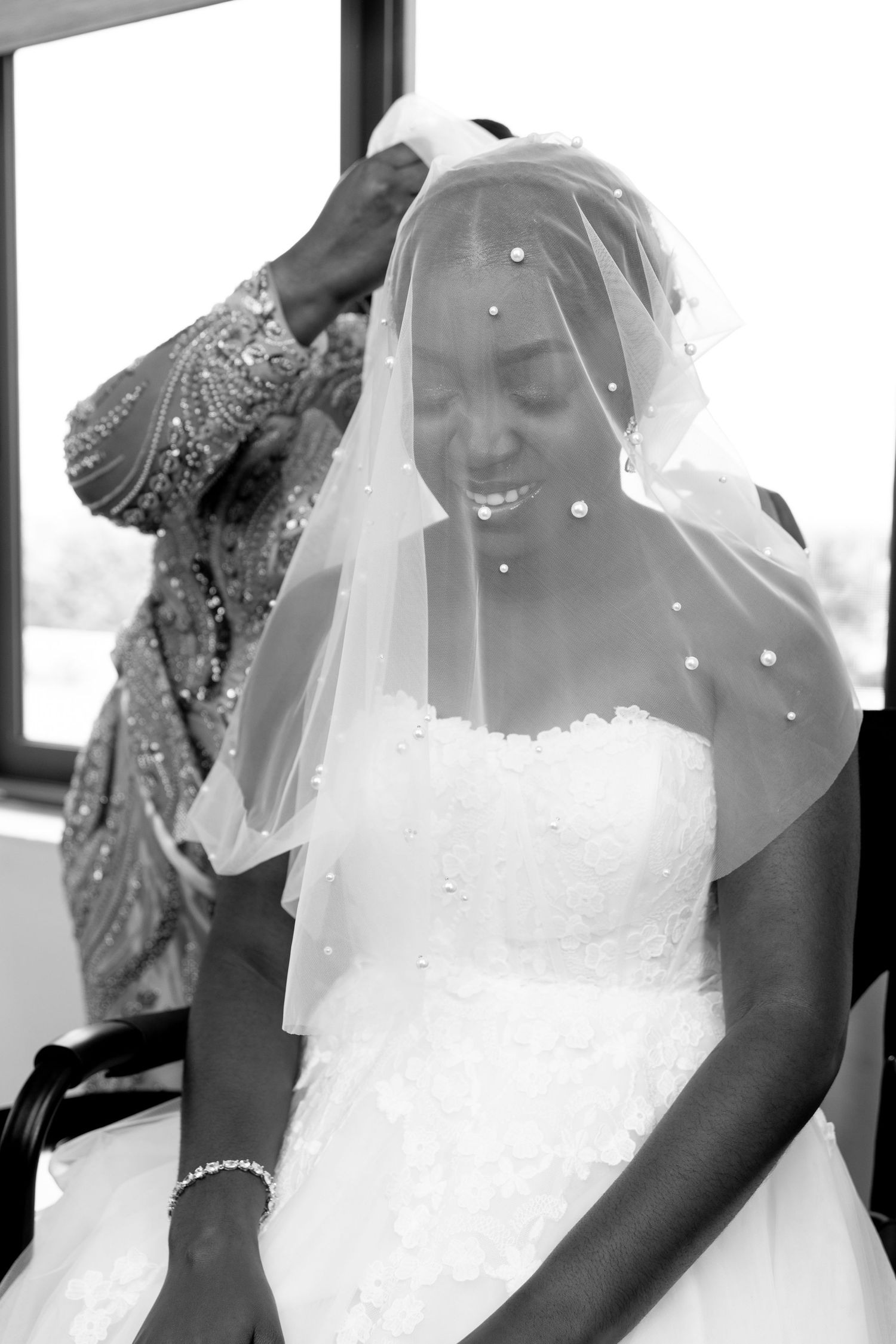 Father kissing bride on the forehead before giving her away