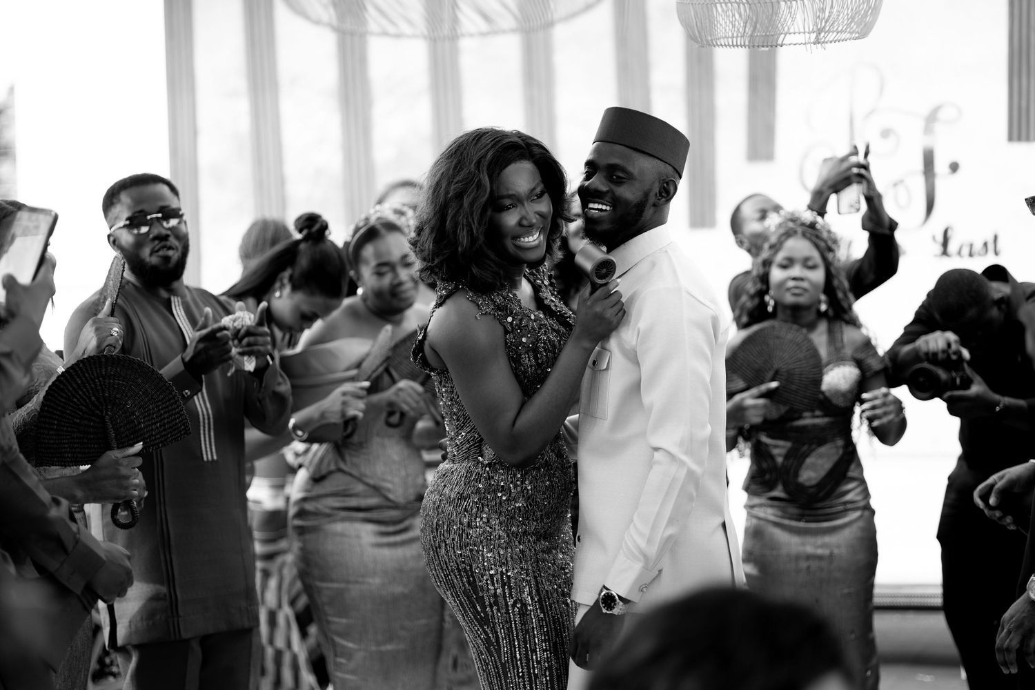 Bride,groom,groomsmenand bridesmaids dancing at a Traditional wedding ceremony in Ghana