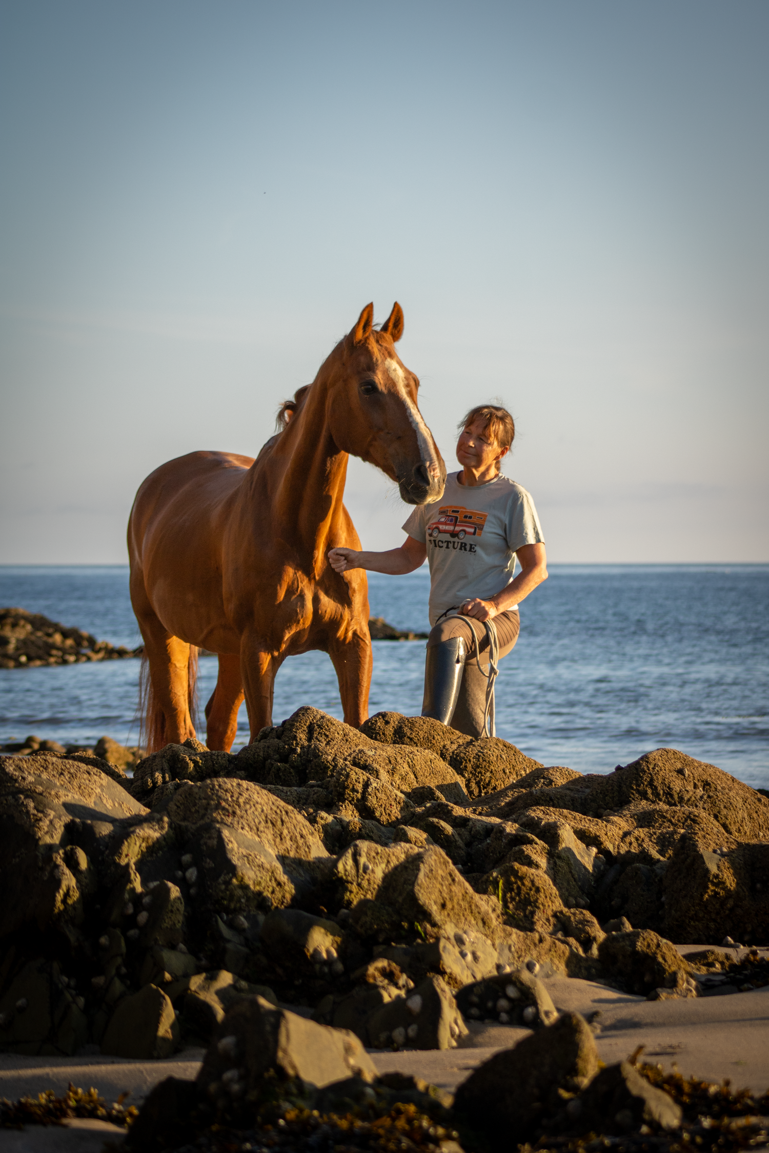 Horse and owner on the beach while posing for pet photographer Clonakilty