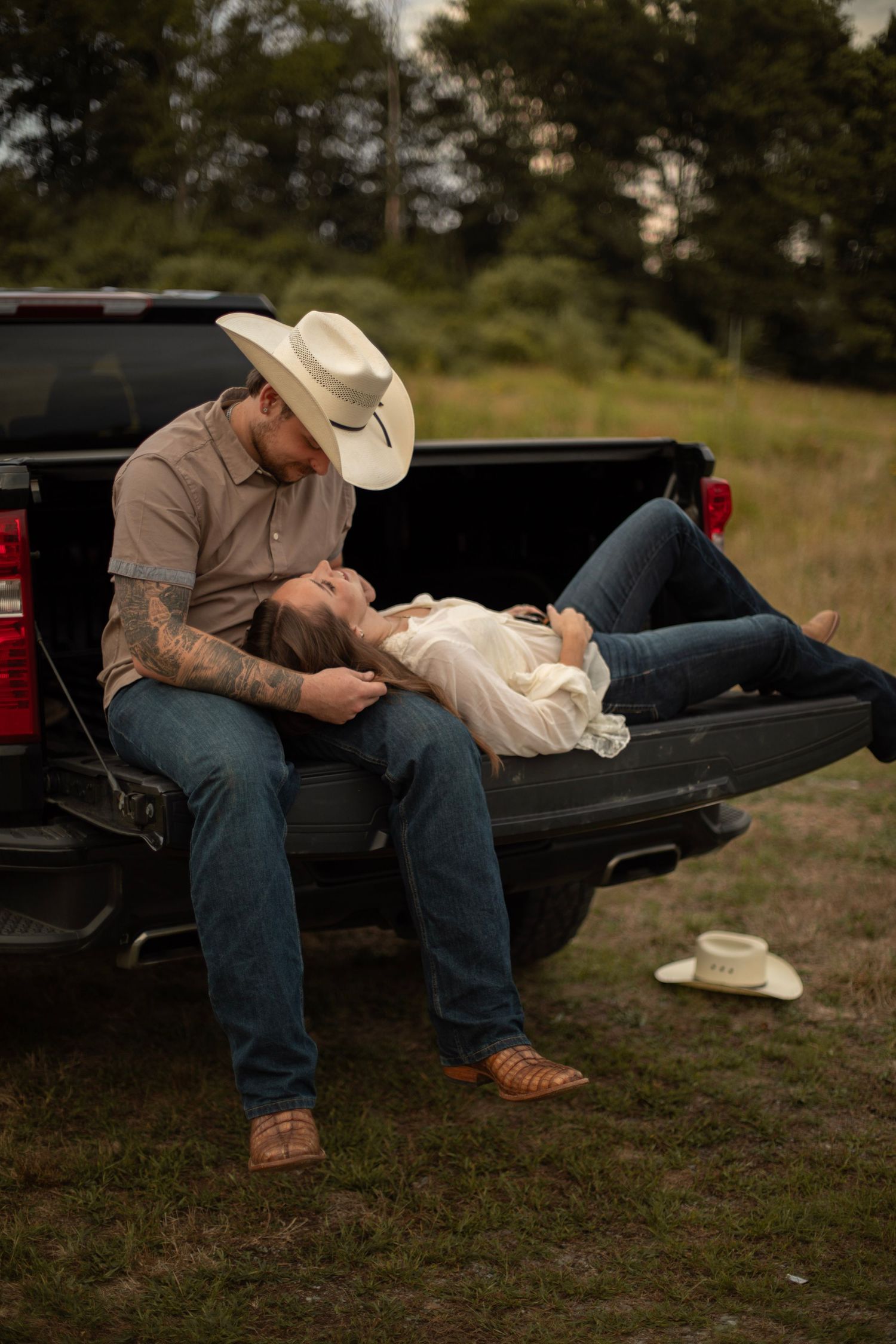 A sequence of photos showing a cowboy hat being placed in the bed of a pickup truck at dusk.