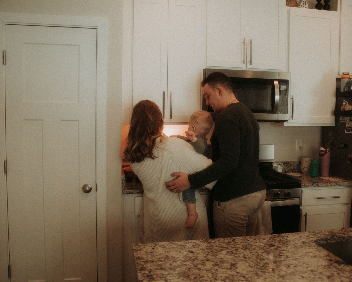 A series of four connected photos showing a romantic kitchen scene with a couple in warm, moody lighting.