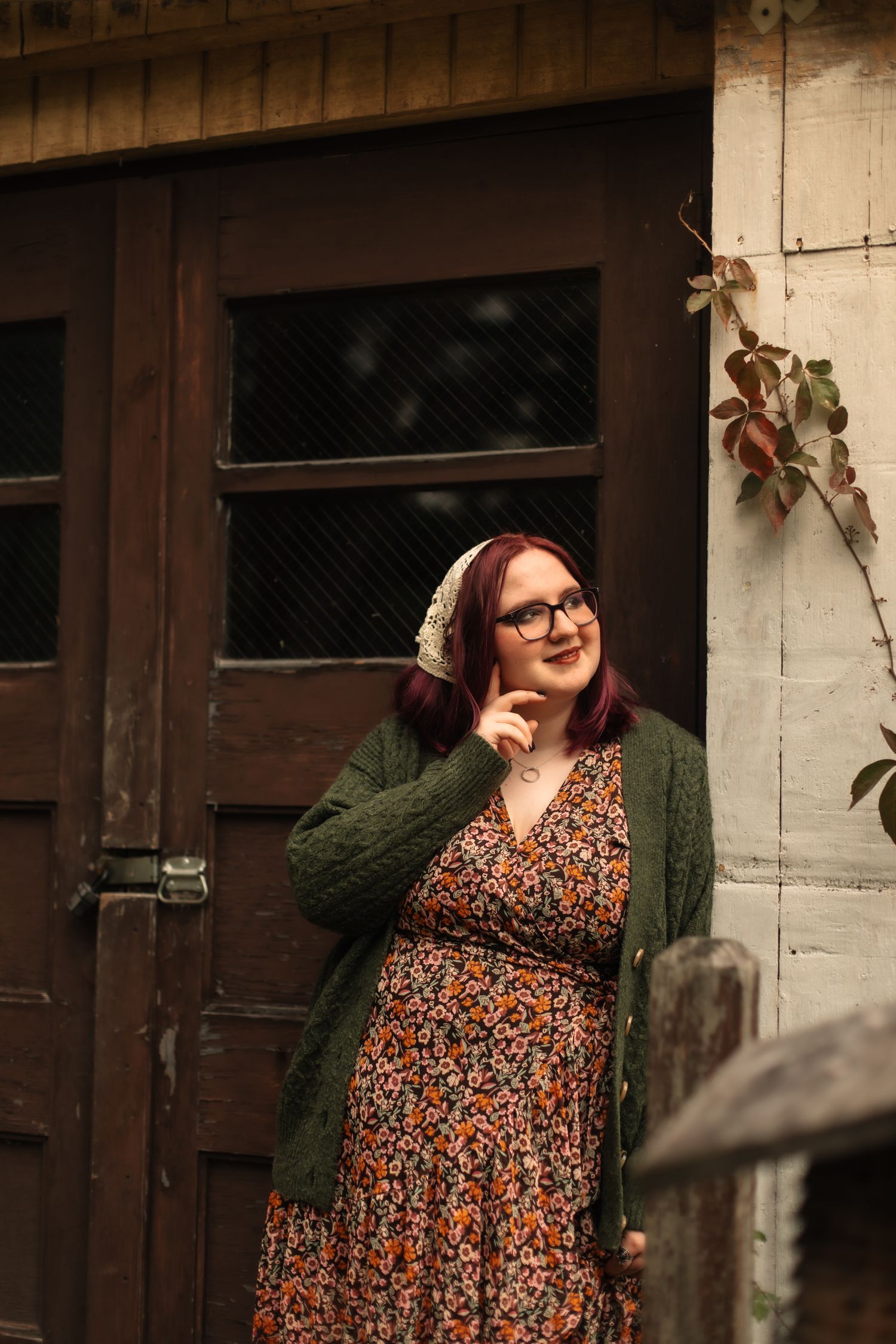 A series of five photos showing a person in a floral dress and green cardigan posing against a rustic doorway.