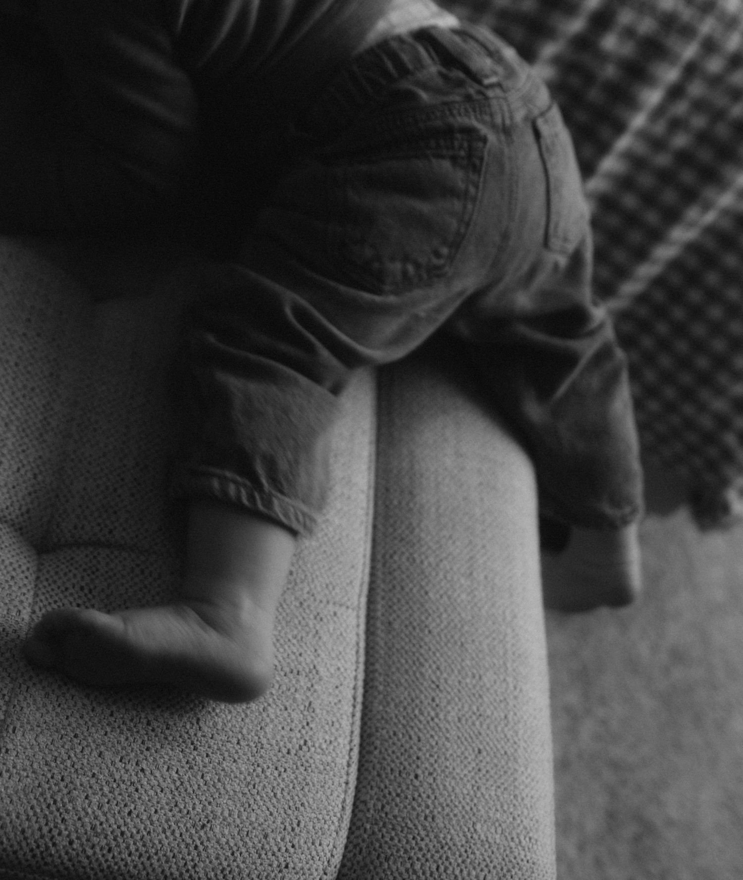 Close-up sequence showing folded denim jeans fabric texture with seam details in black and white.