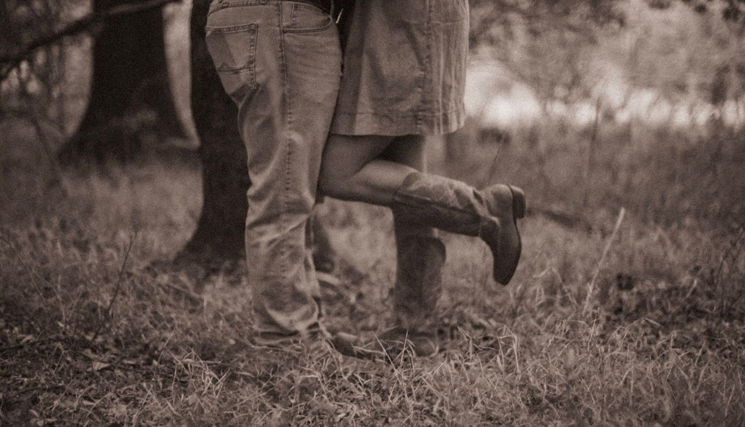 A series of black and white photographs showing people's legs walking through a grassy outdoor setting.