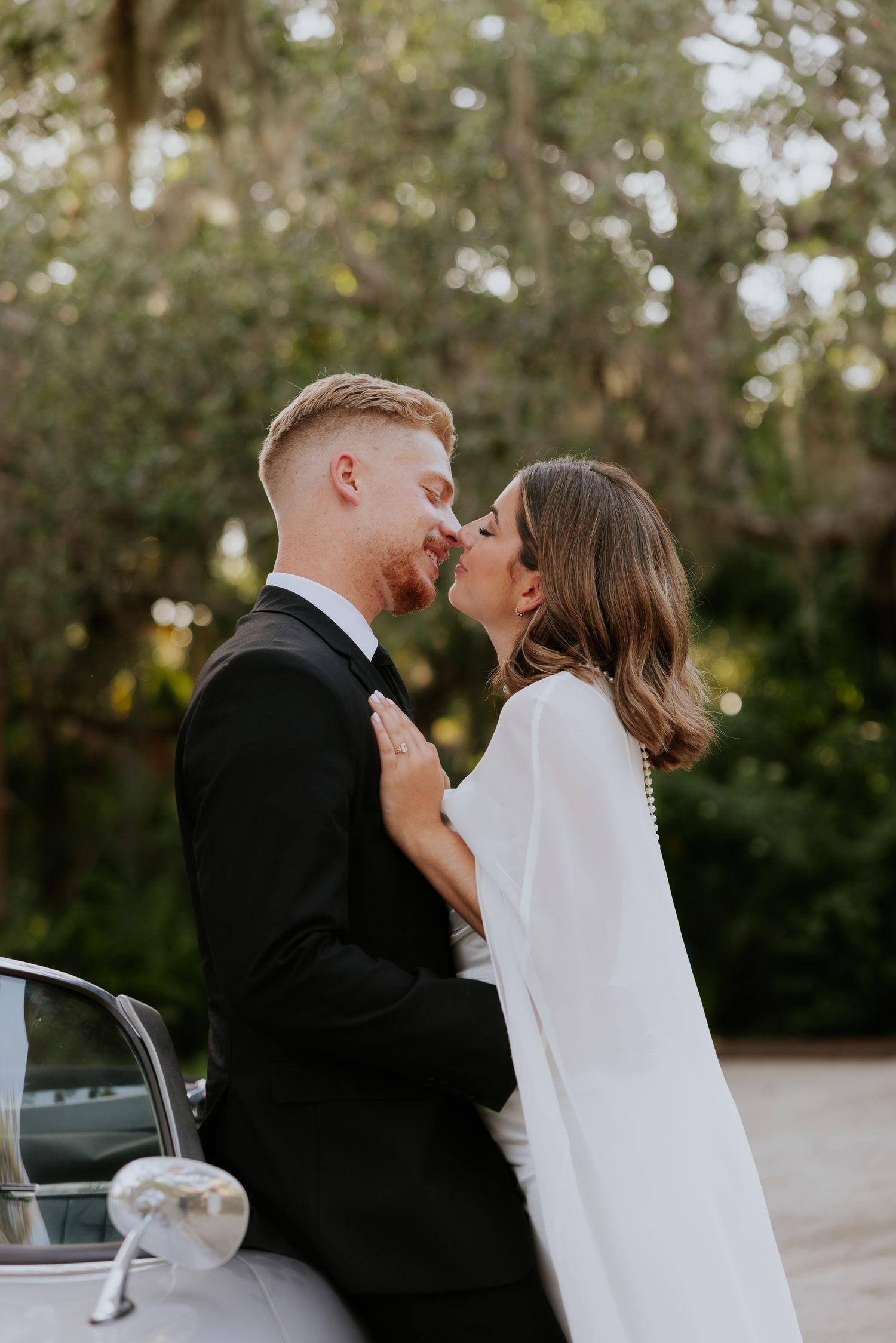 Timeless bride and groom moment sharing effection