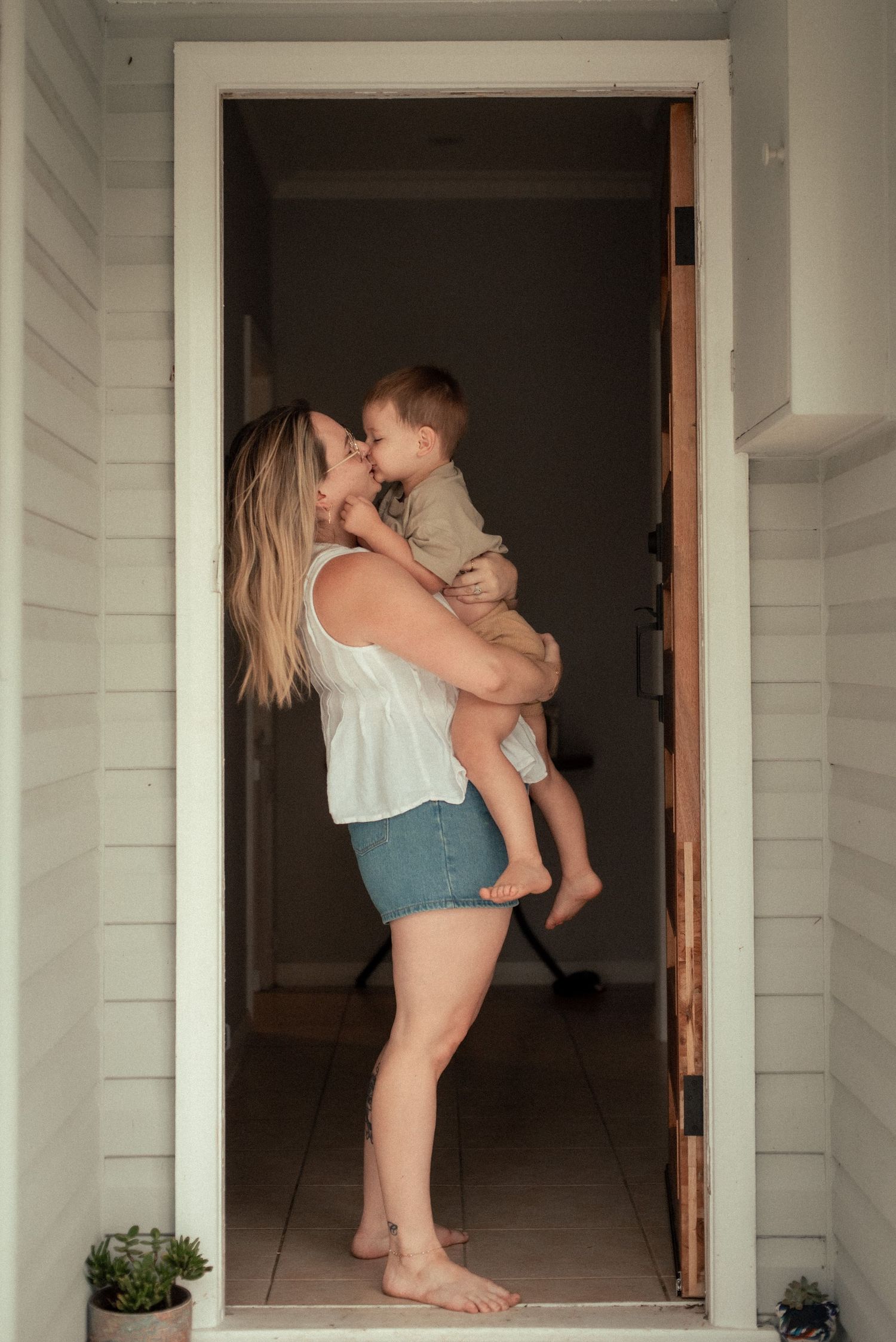 Mother and child snuggling at home