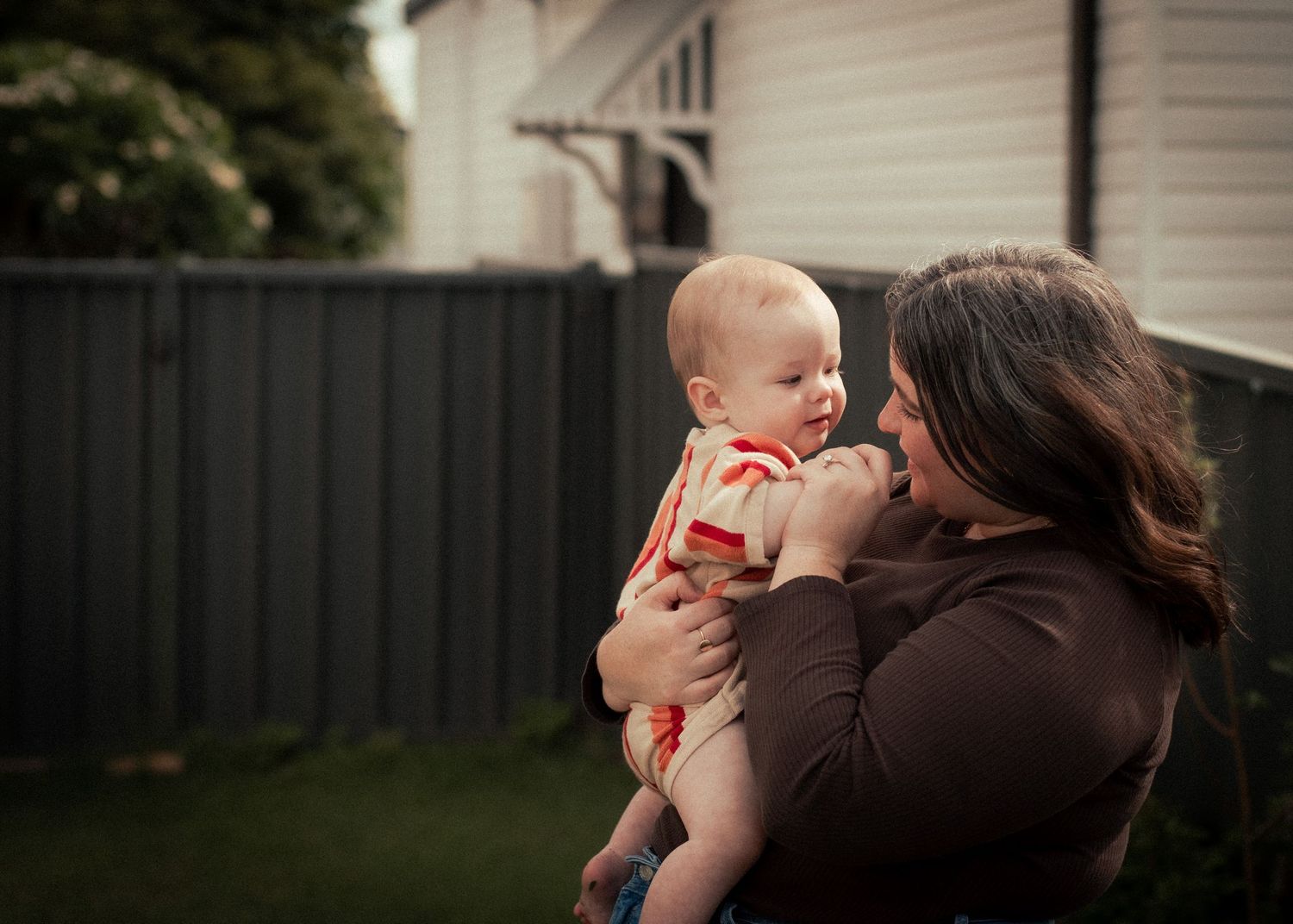 Maitland, mother and child snuggling at home