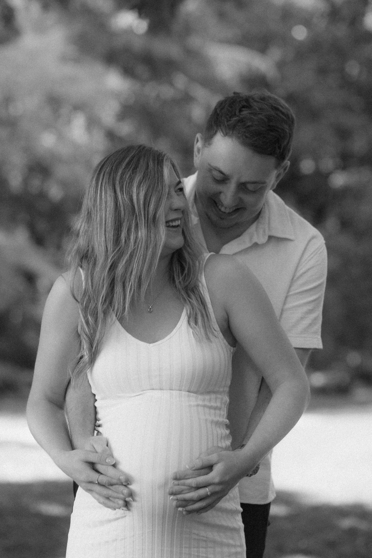 Pregnant woman and partner walking together during maternity photography session West Yorkshire