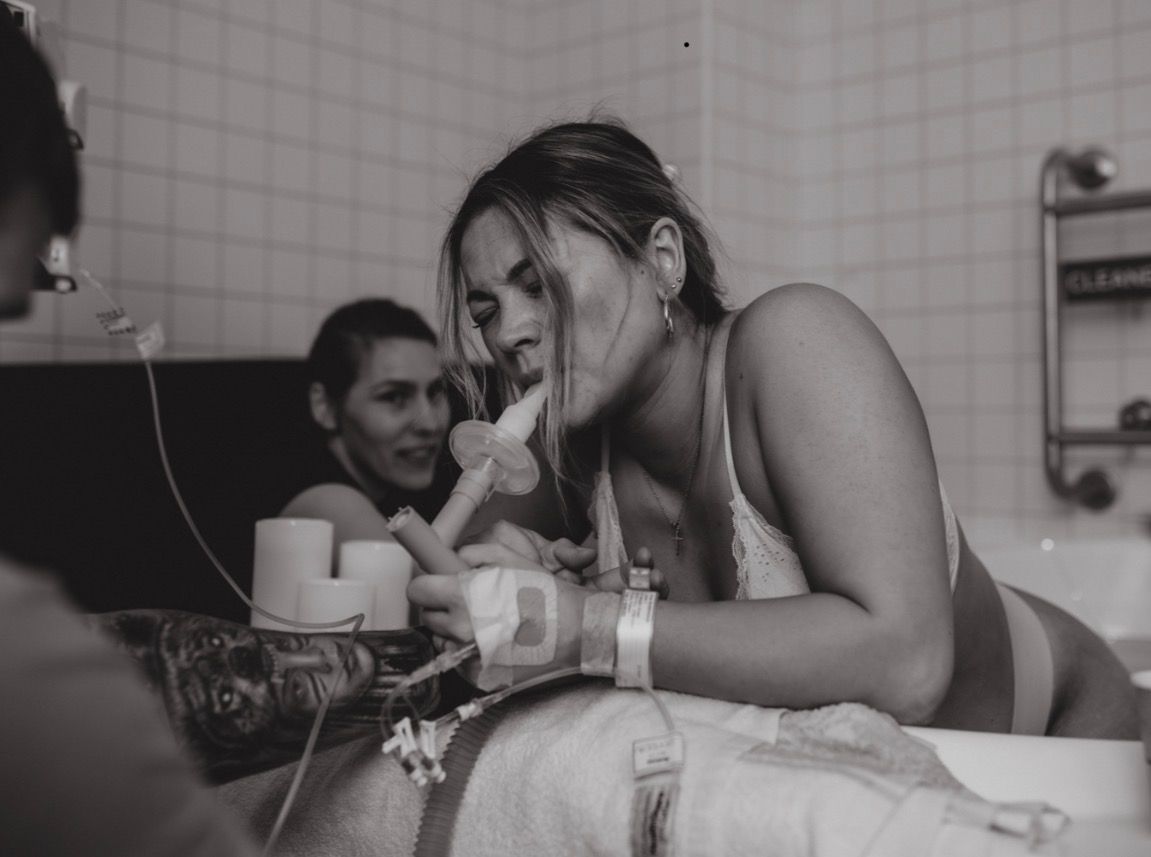 Documentary birth photography capturing baby’s arrival in Huddersfield with raw emotional storytelling moments