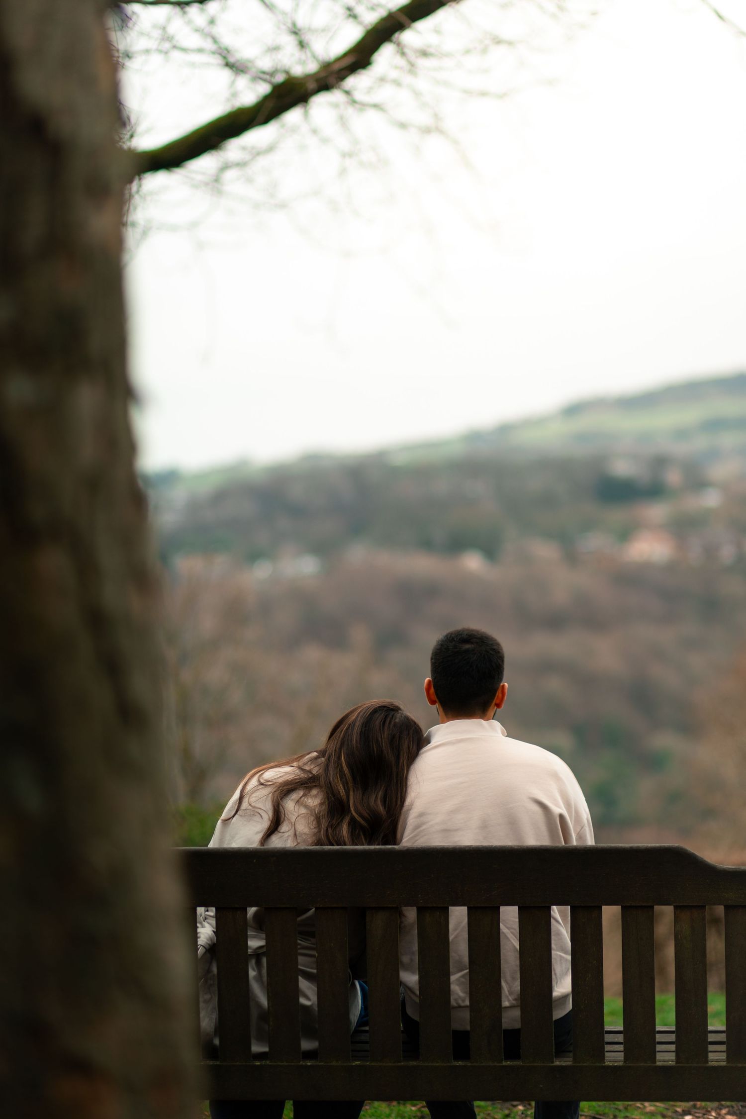Couple sharing kiss during golden hour engagement photography session West Yorkshire