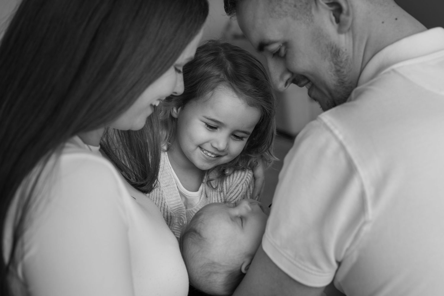 Close emotional portrait of parents and newborn baby Huddersfield in home photography session